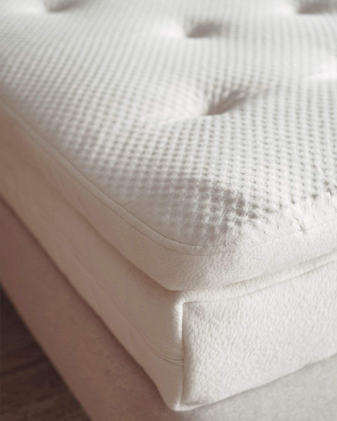 Kakun Organic Luxury Topper - corner view on a mattress