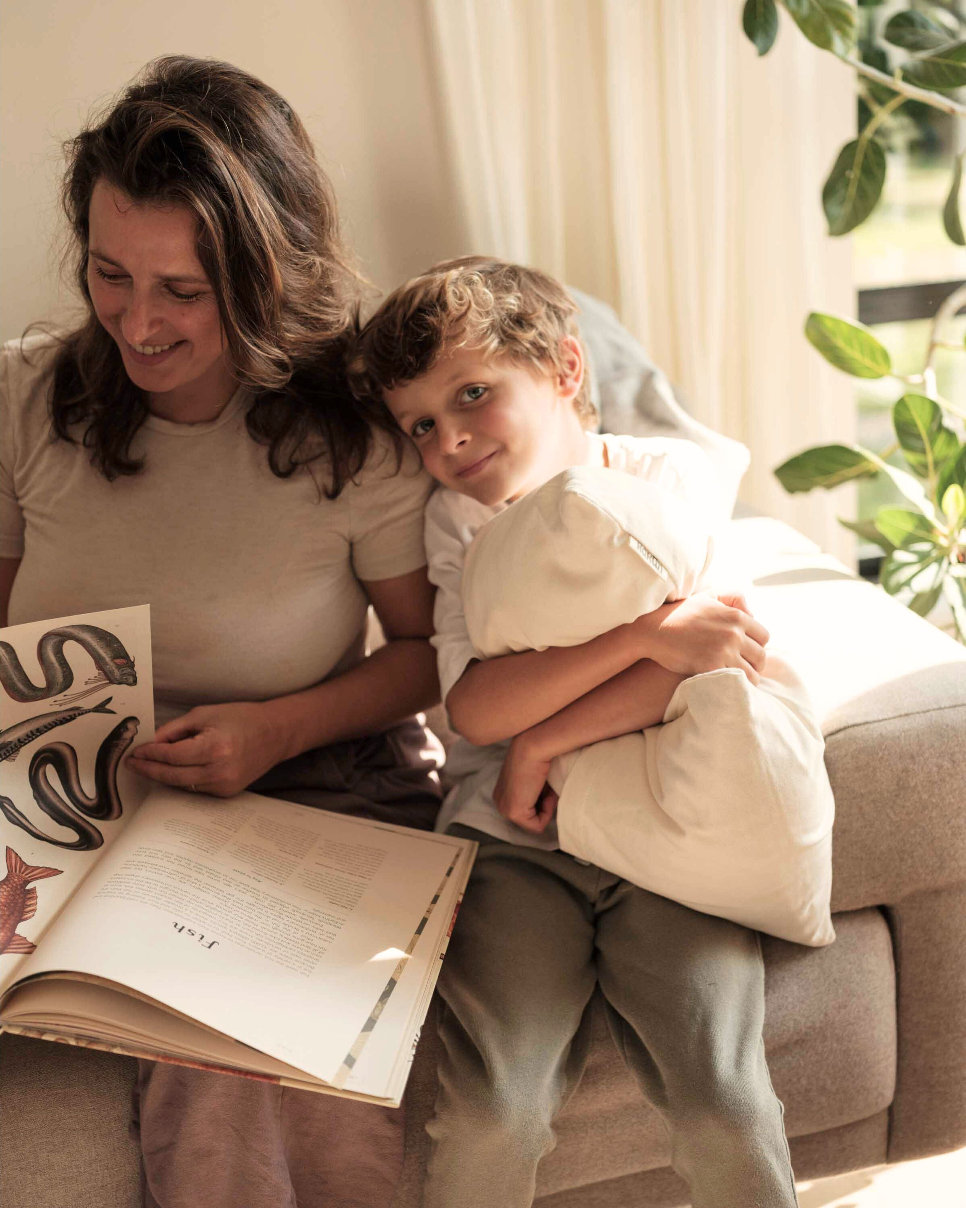 Kakun Organic Travel Pillow - held by child with mother