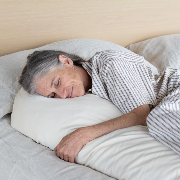 Kakun Organic Wool Body Pillow - view from front of model hugging pillow