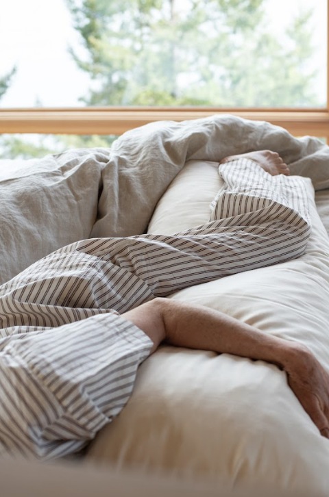 Kakun Organic Wool Body Pillow - being hugged with view from top of bed