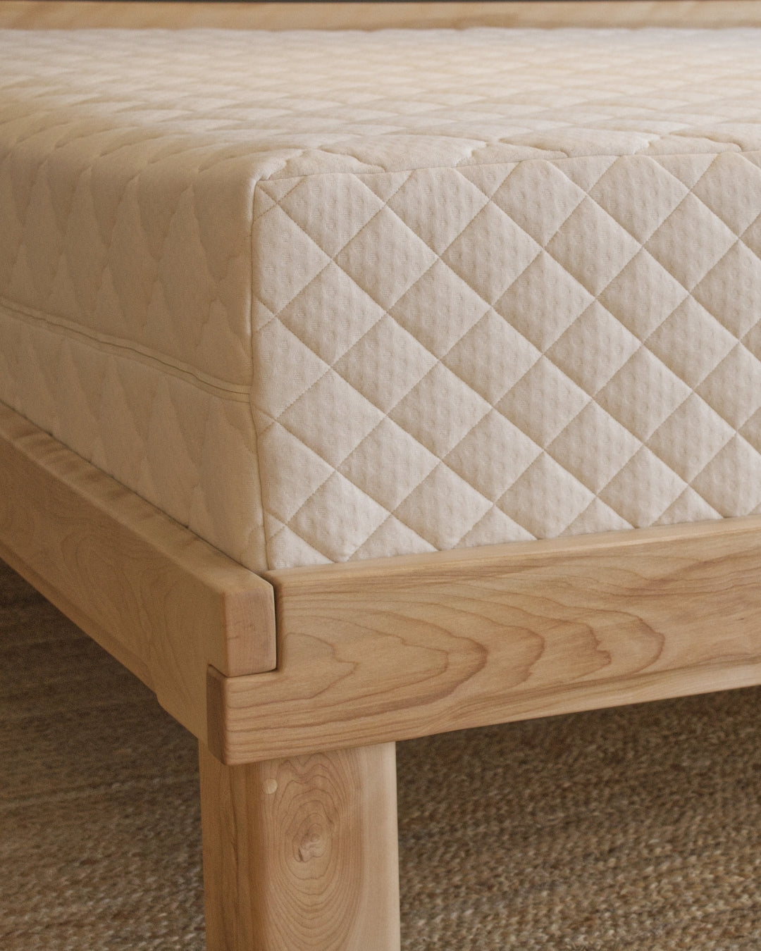 Wooden bed frame with a Kakun Organic Latex mattress
