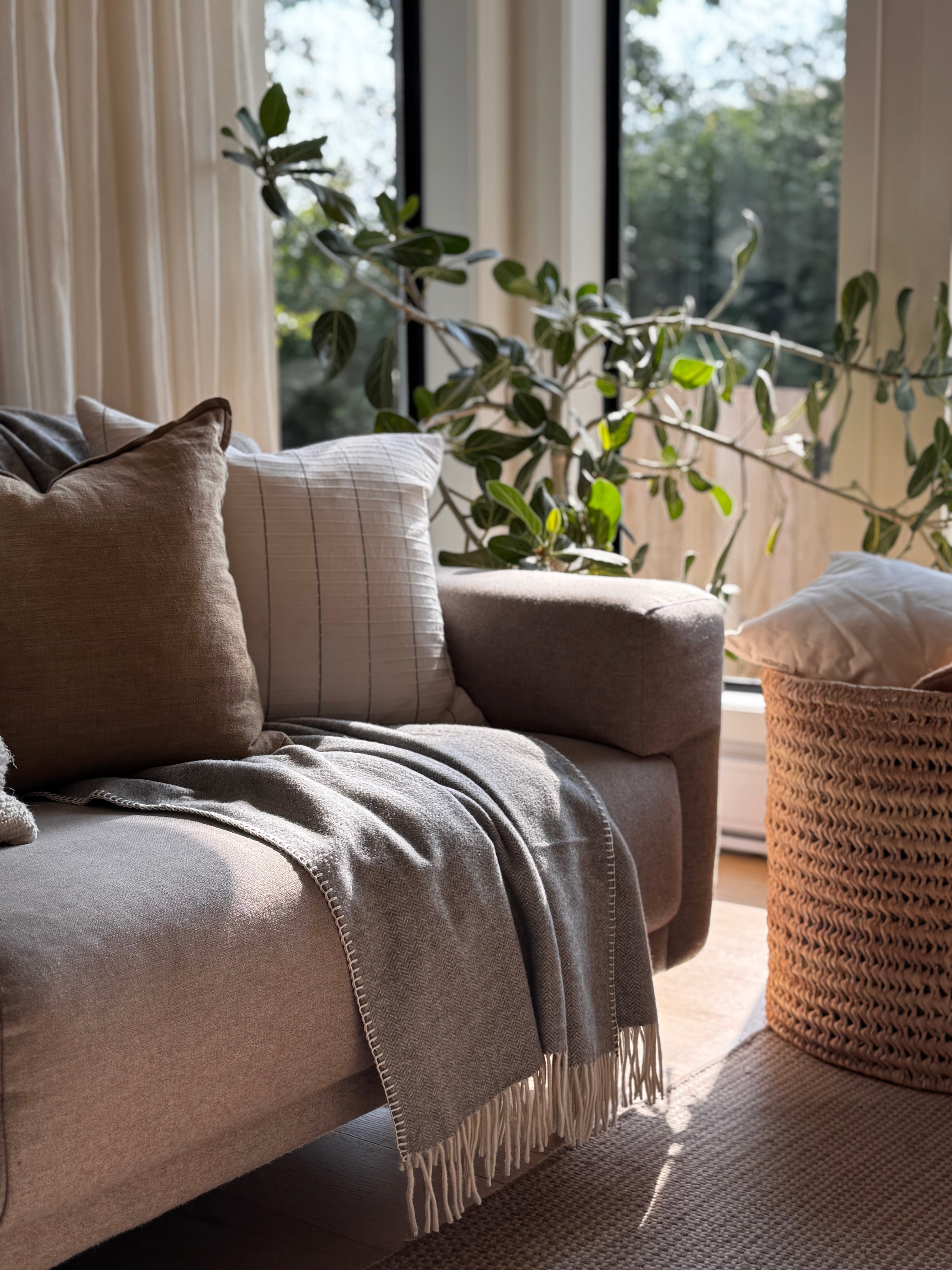 Kakun Wool Herringbone Throw - lifestyle shot with soft lighting