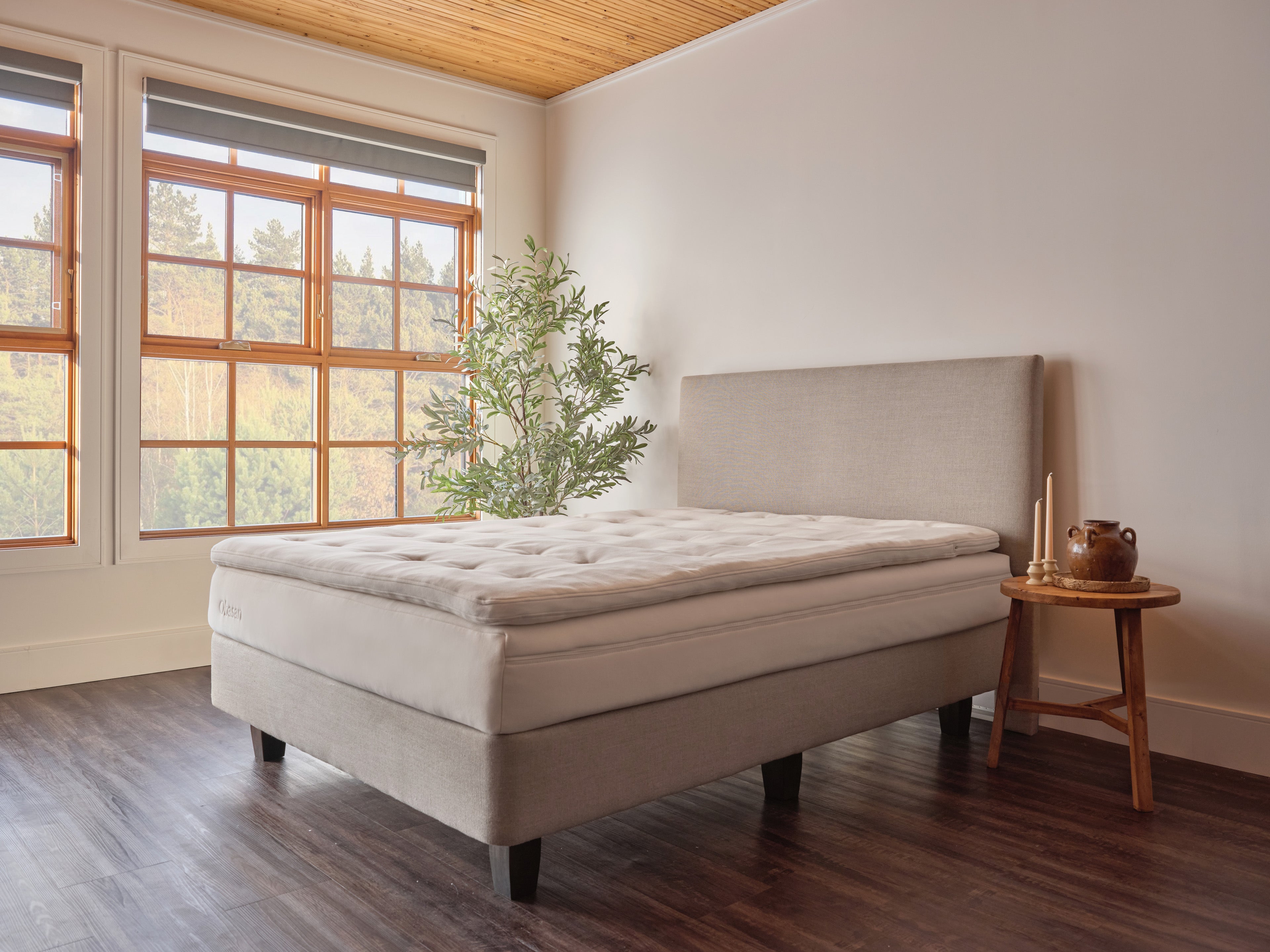 Obasan Organic Latex Classic Mattress - angled view with natural light in minimalist setting