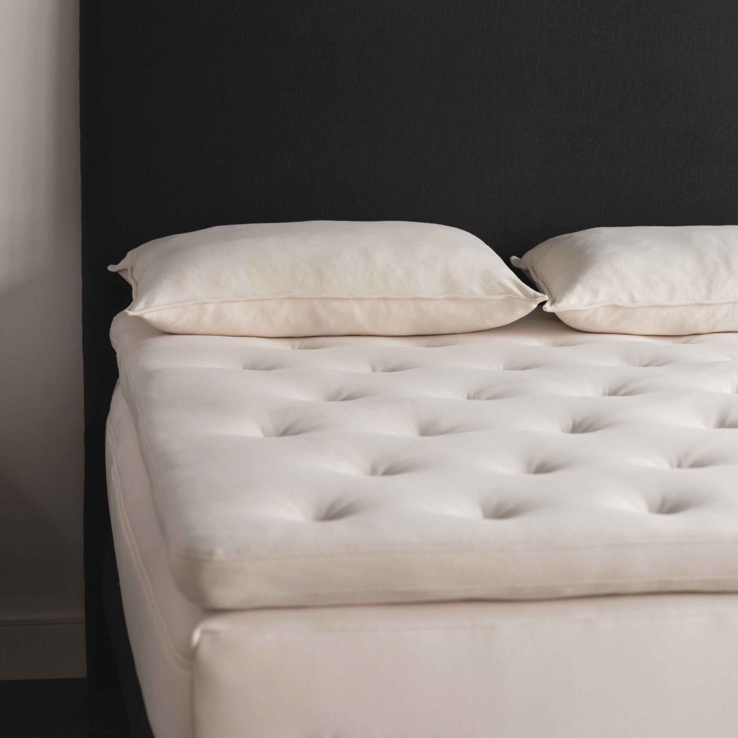 Obasan Grand Organic Latex Mattress - corner shot with topper and pillows