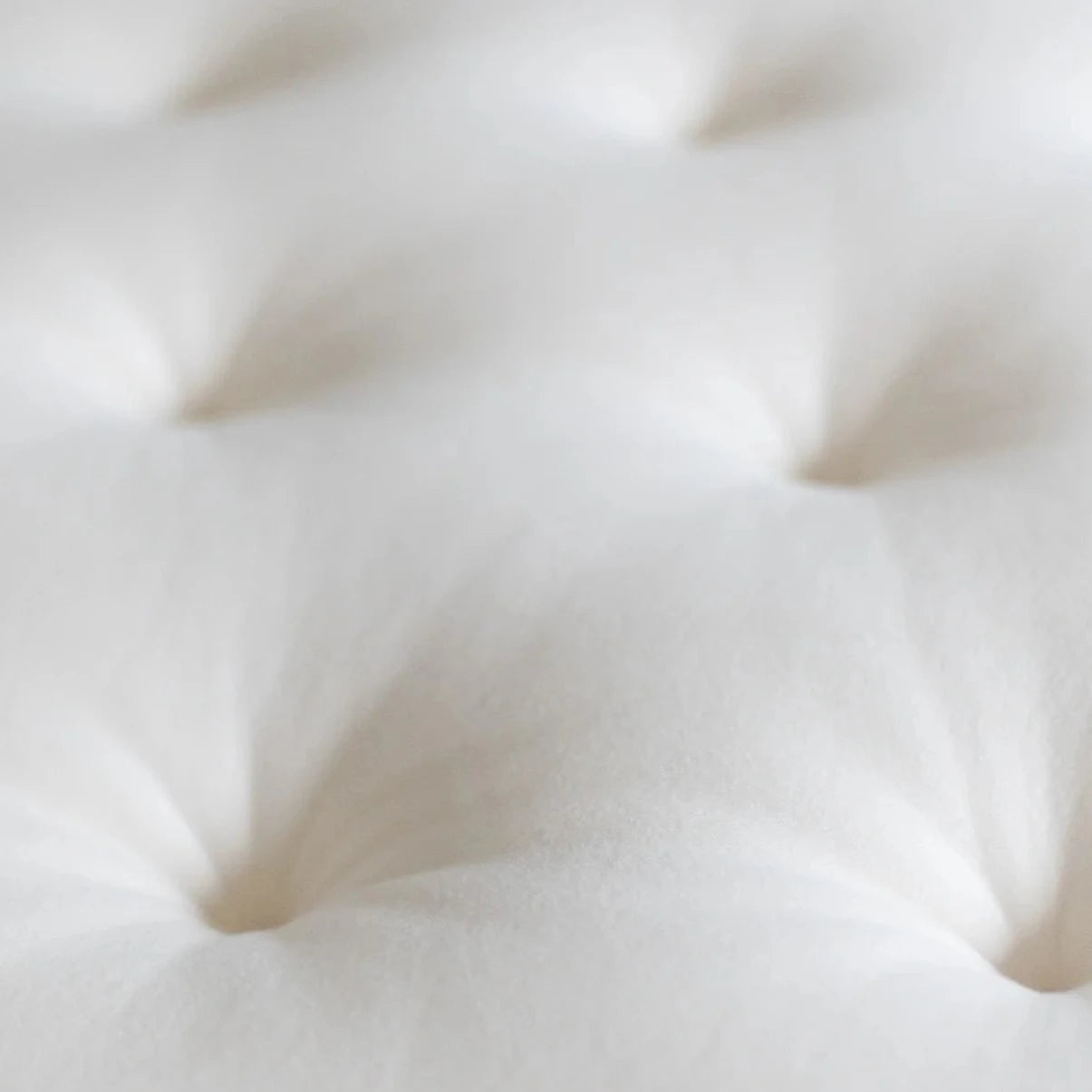 Obasan Grand Organic Mattress Topper - close up of tufting and soft fabric