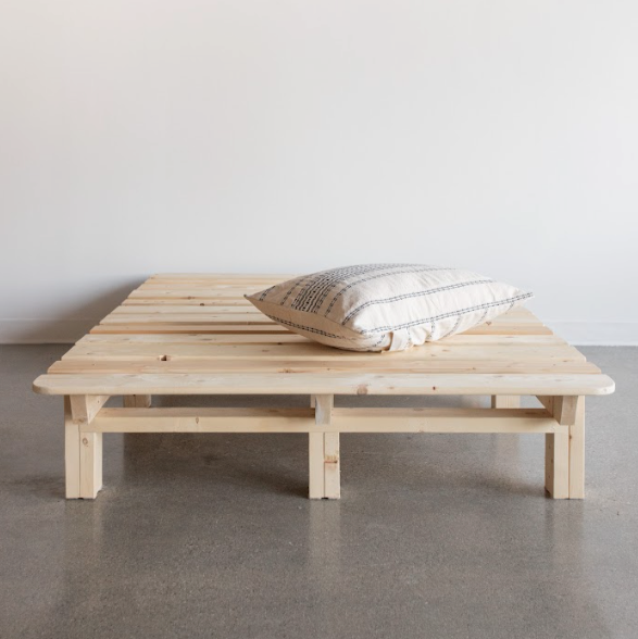 Resthouse Magic Platform Bed Frame - front view with pillow on top of wood frame