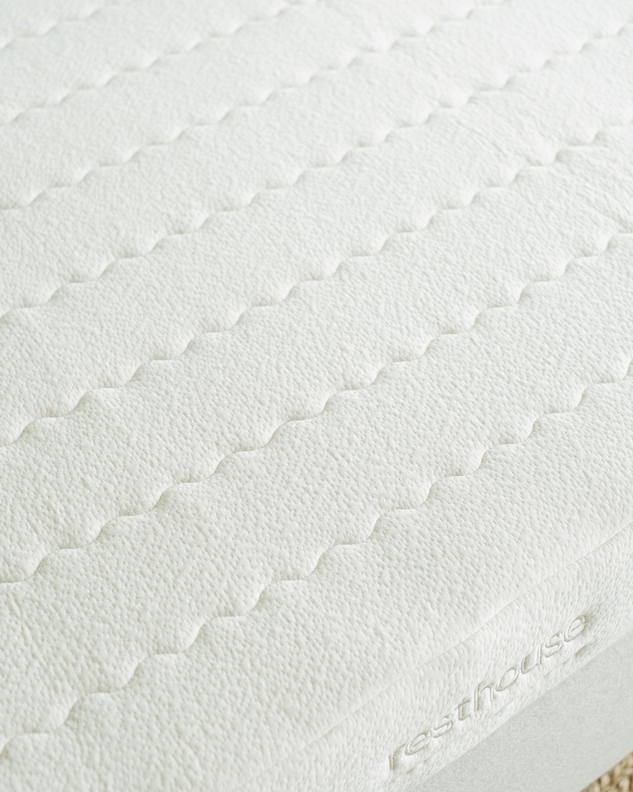 Resthouse Retreat Light Organic Latex Mattress - close up of casing logo showing