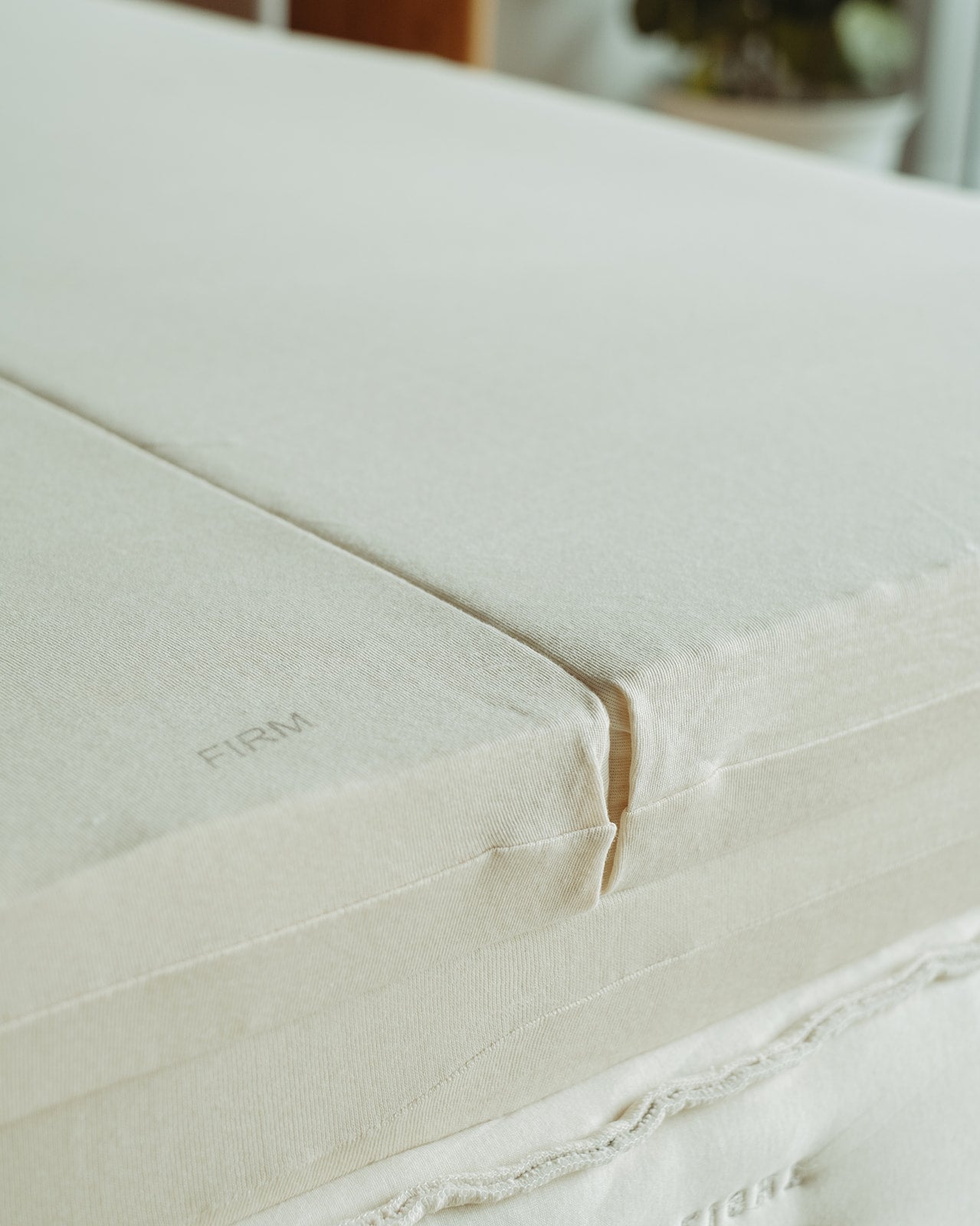 Resthouse Retreat Light Organic Latex Mattress - unzipped cover showing firm latex layer with queen split