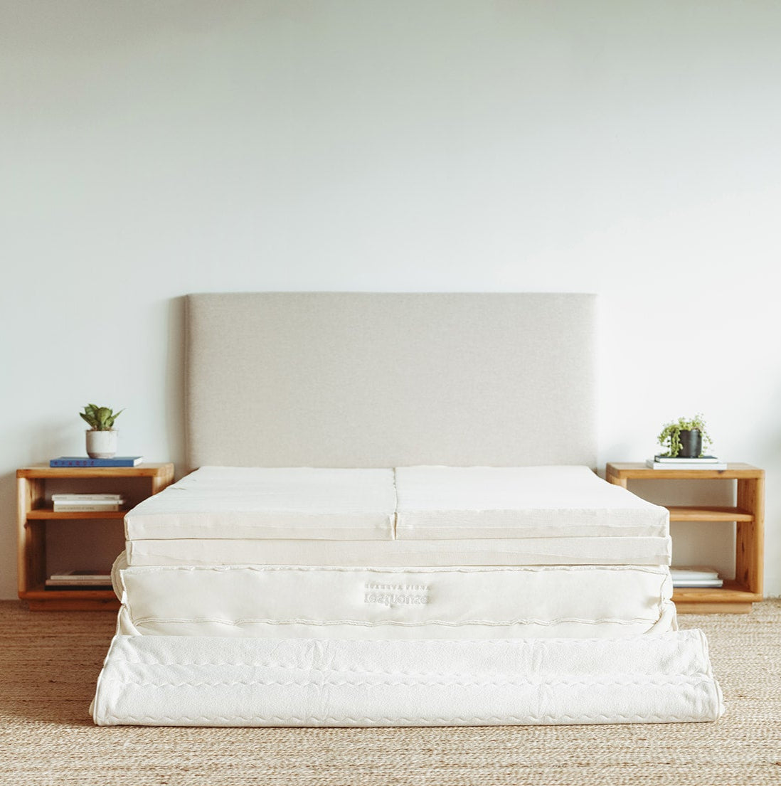 Resthouse Retreat Light Organic Latex Mattress - unzipped cover folded back staged with plants