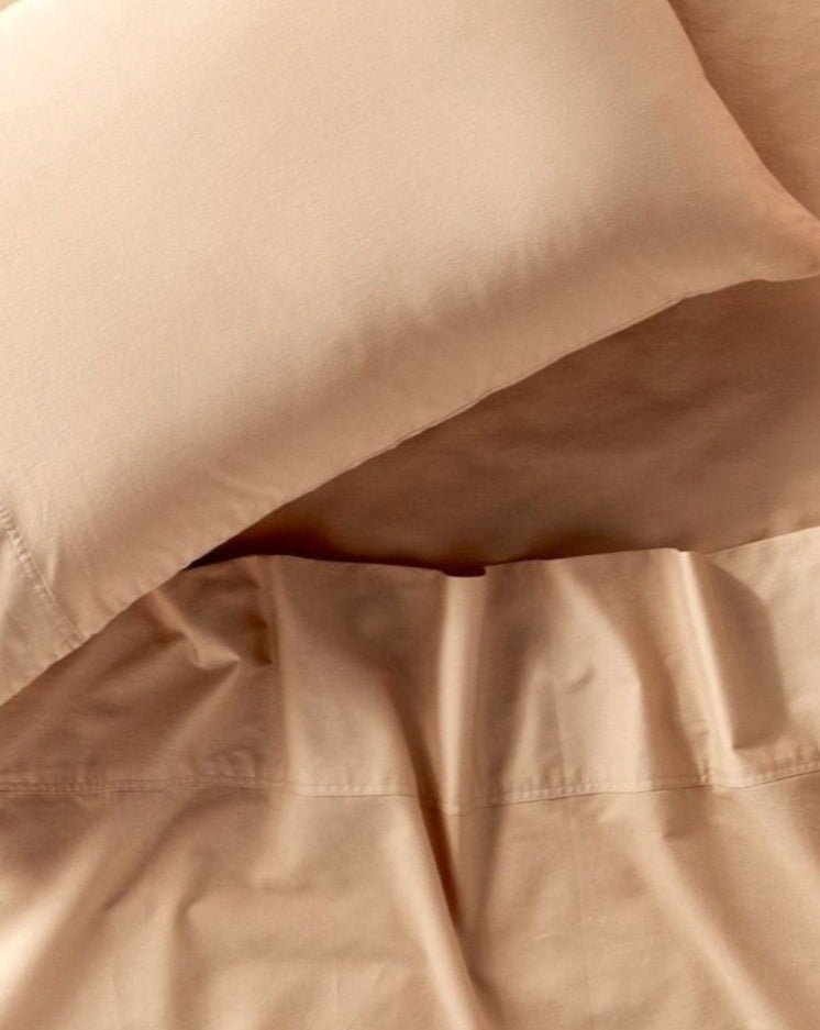 Coyuchi Organic Cloud Soft Sateen Pillowcase - close up of sheets and pillow #colour_chai