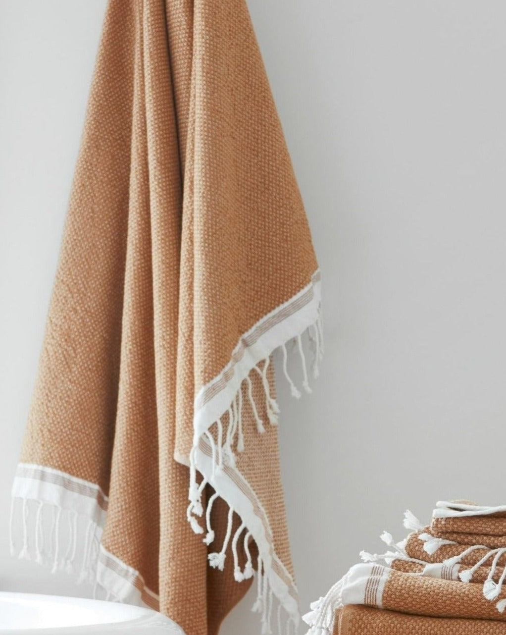 Coyuchi Organic Cotton Mediterranean Towel - hanging in bathroom #colour_Coyuchi Cotton w/ Rust Stripes