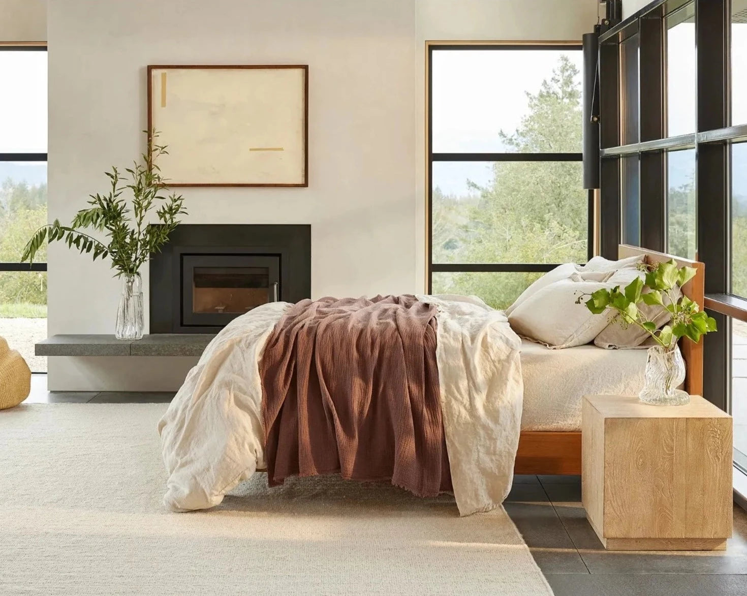 Coyuchi Organic Cotton Topanga Matelasse Blanket - draped over staged bed natural lighting #colour_redwood