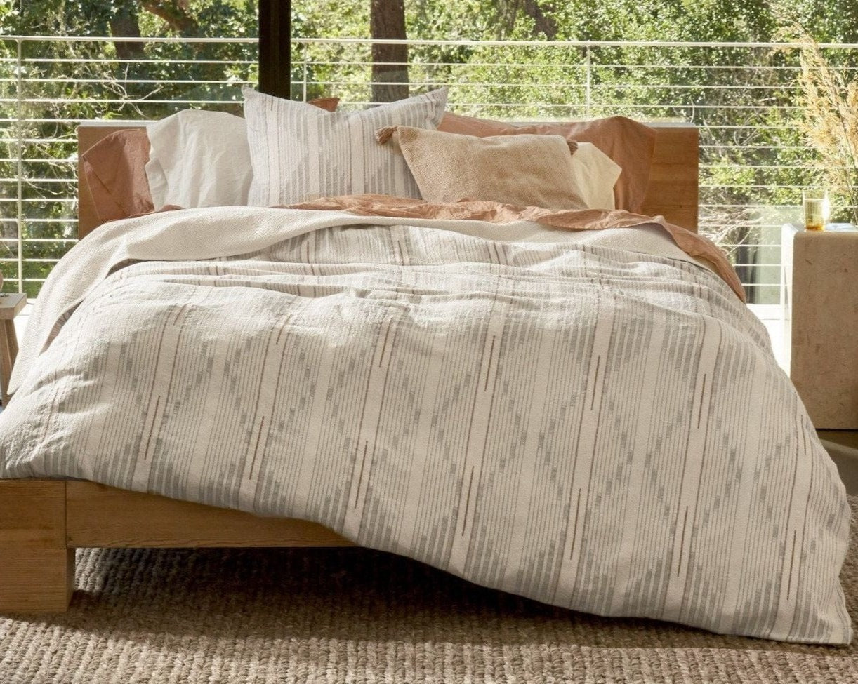 Coyuchi Organic Morelia Duvet Cover - staged bed wood frame with large window #colour_harvest