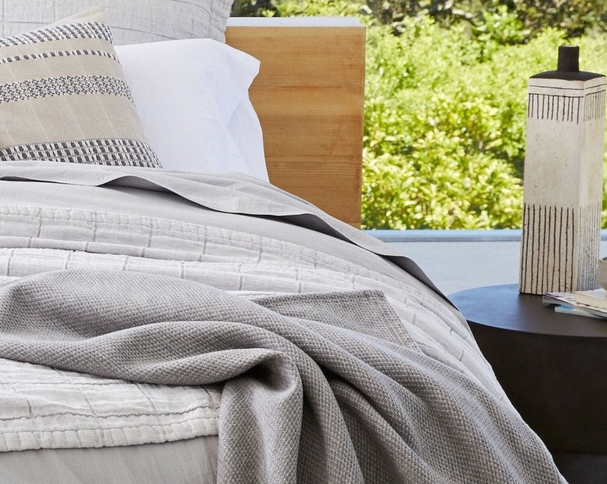 Coyuchi Organic Sequoia Cotton Wool Blanket - lifestyle shot with wood headboard #colour_Gray