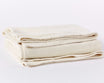 Coyuchi Organic Sequoia Cotton Wool Blanket - folded #colour_undyed
