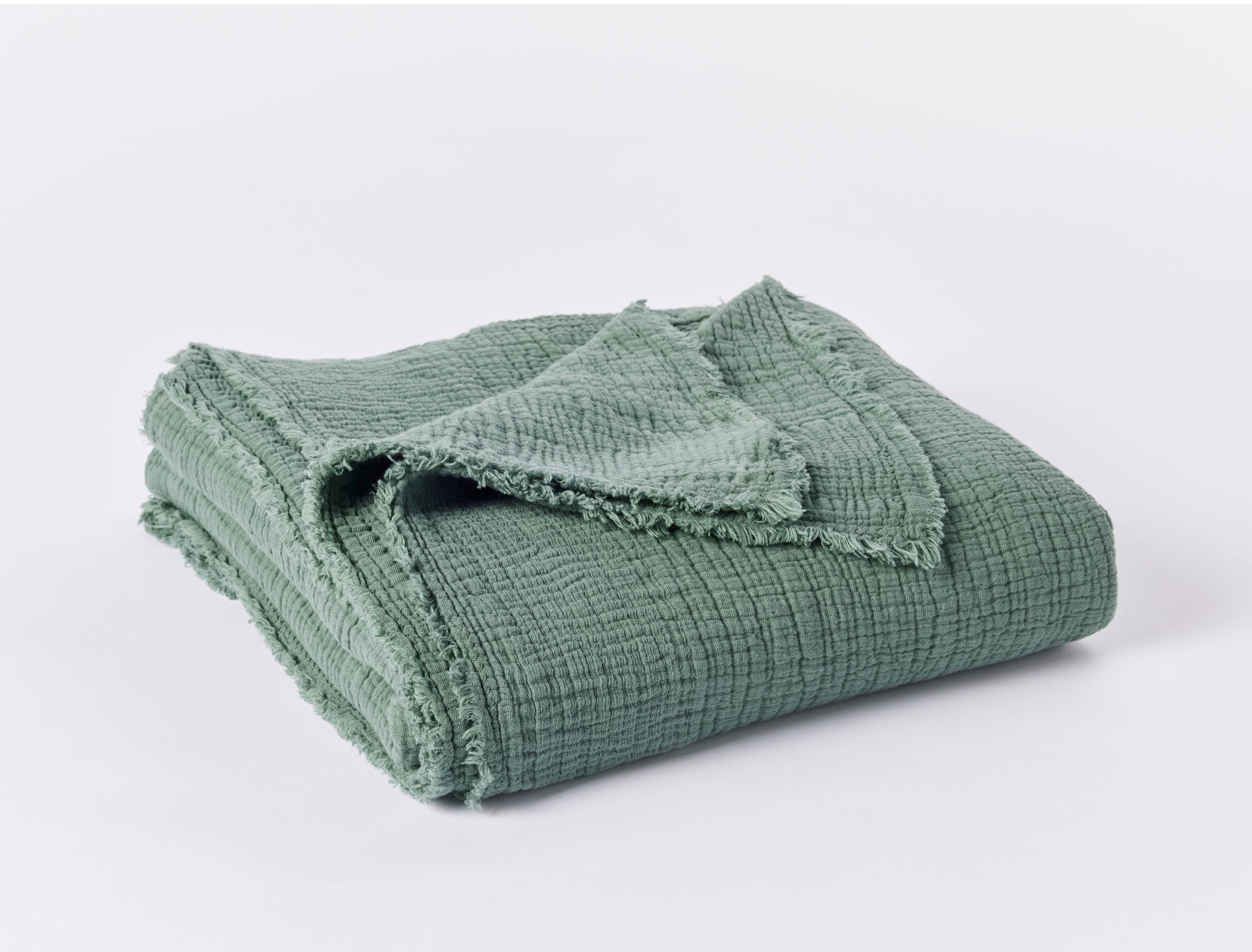 Coyuchi Topanga Organic Cotton Matelasse Throw - folded #colour_juniper