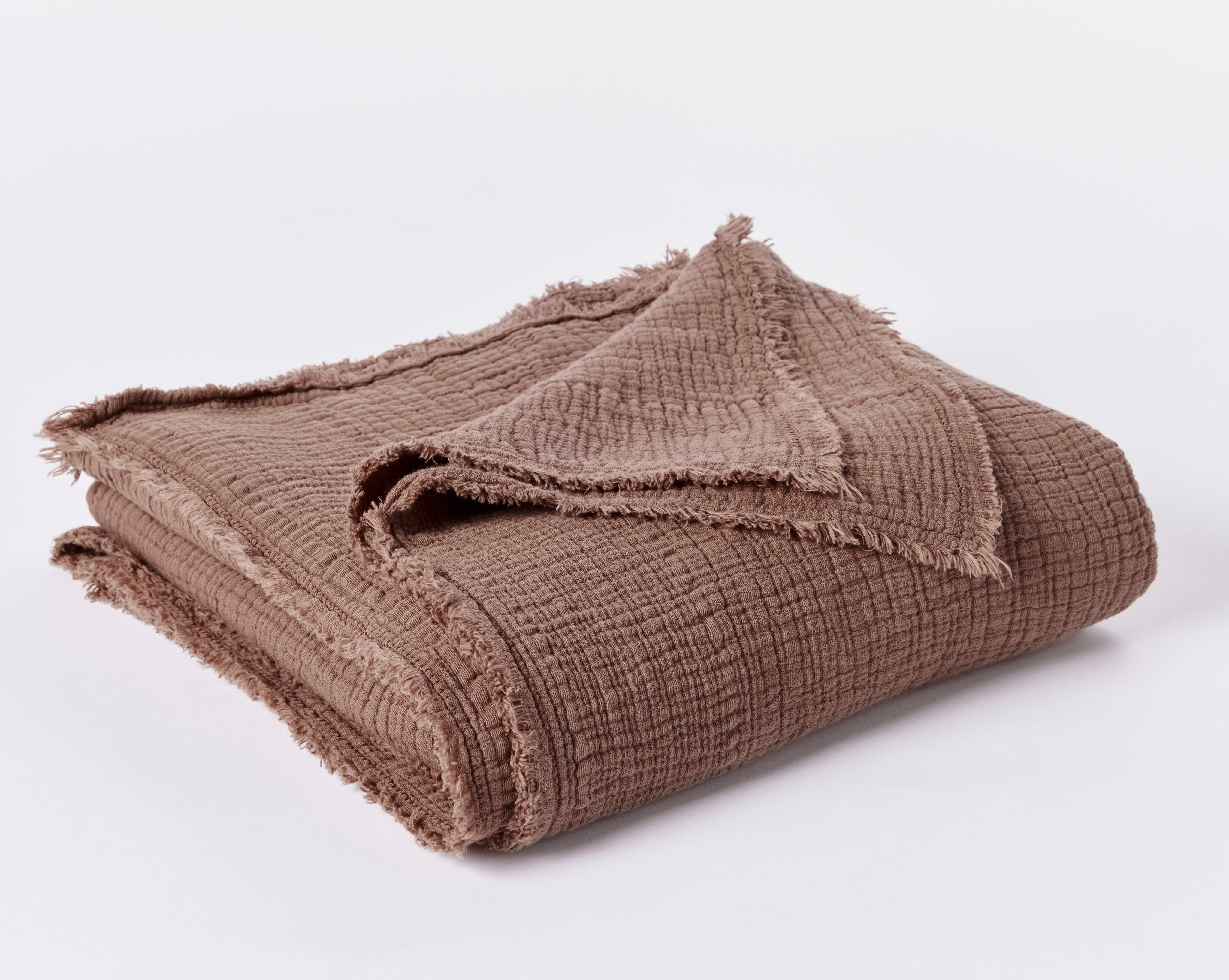 Coyuchi Topanga Organic Cotton Matelasse Throw - folded #colour_redwood