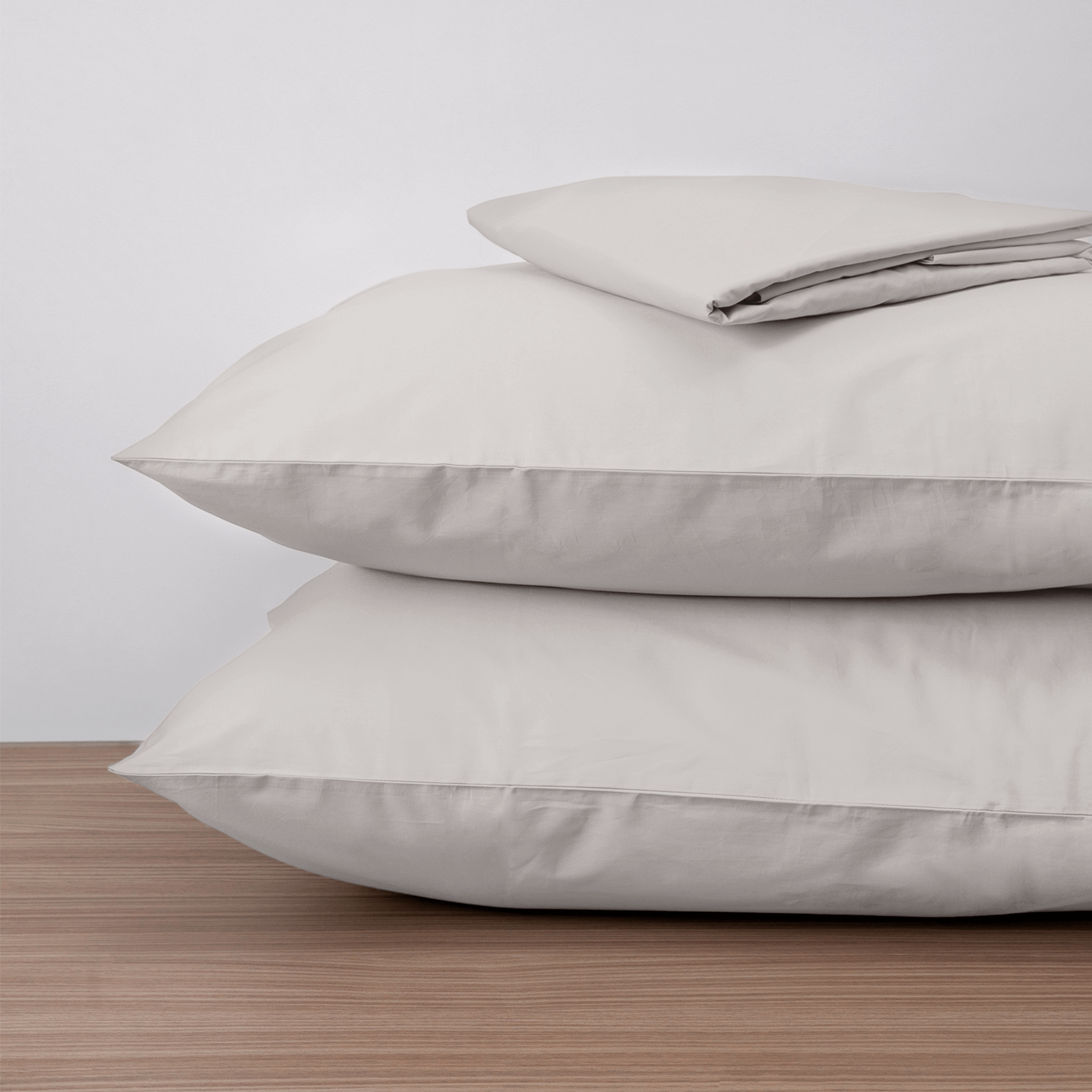 Homebird Organic Percale Fitted Sheet and Pillowcases - on pillows #colour_gray