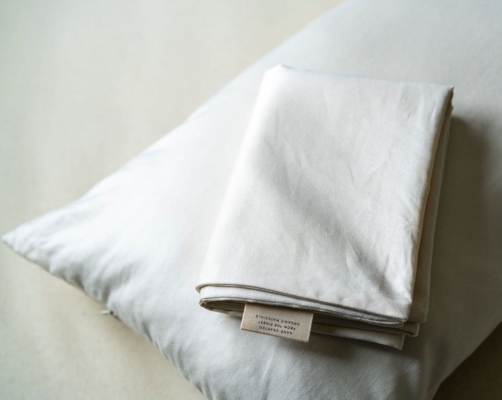 Kakun Organic Cotton Customizable Pillow Case - inner folded on top of full pillow