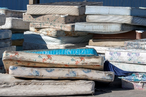 Stack of mattresses at dump