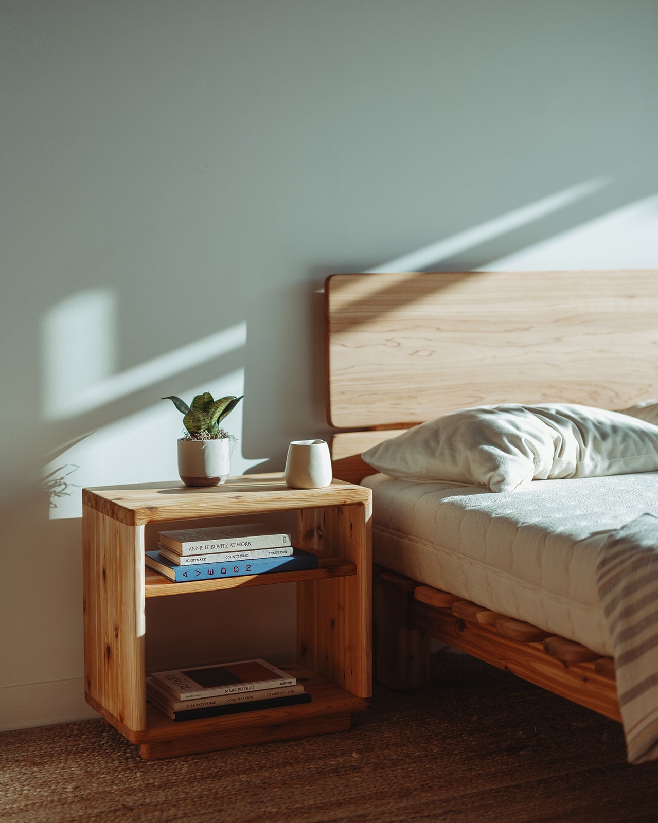 Adrift Cedar Crest Bedside Table - next to matching bed frame with natural light