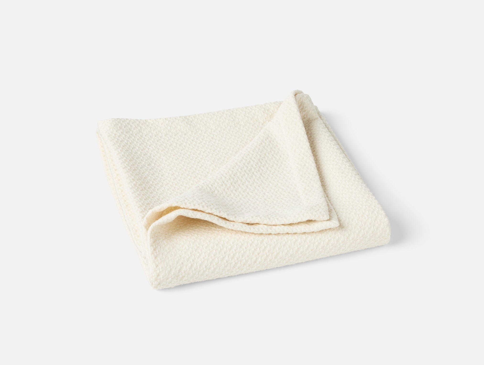 Coyuchi Organic Cotton Classic Baby Blanket - neatly folded on white background #colour_undyed