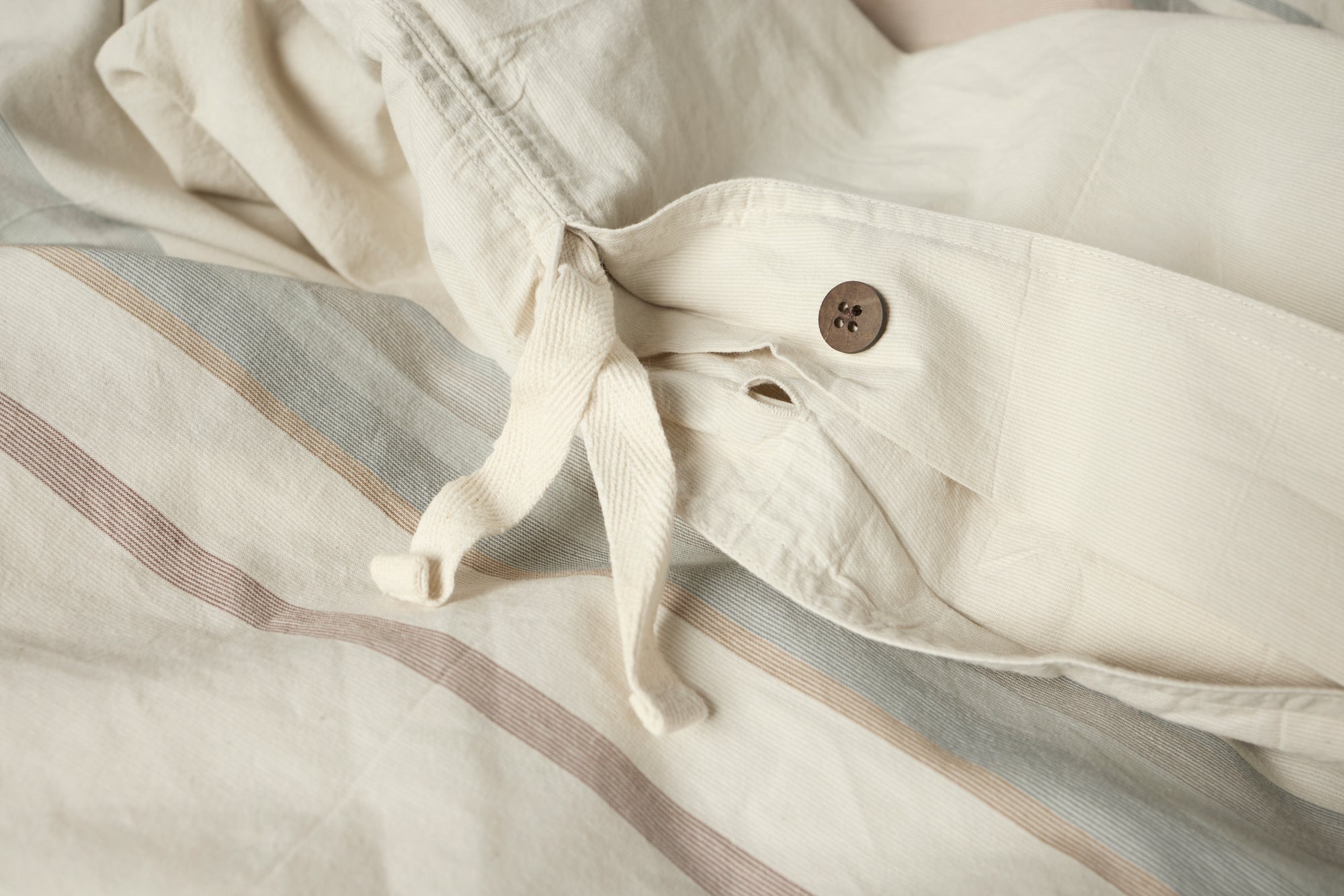 Coyuchi Crestridge Organic Duvet Cover - close up of button encasement 