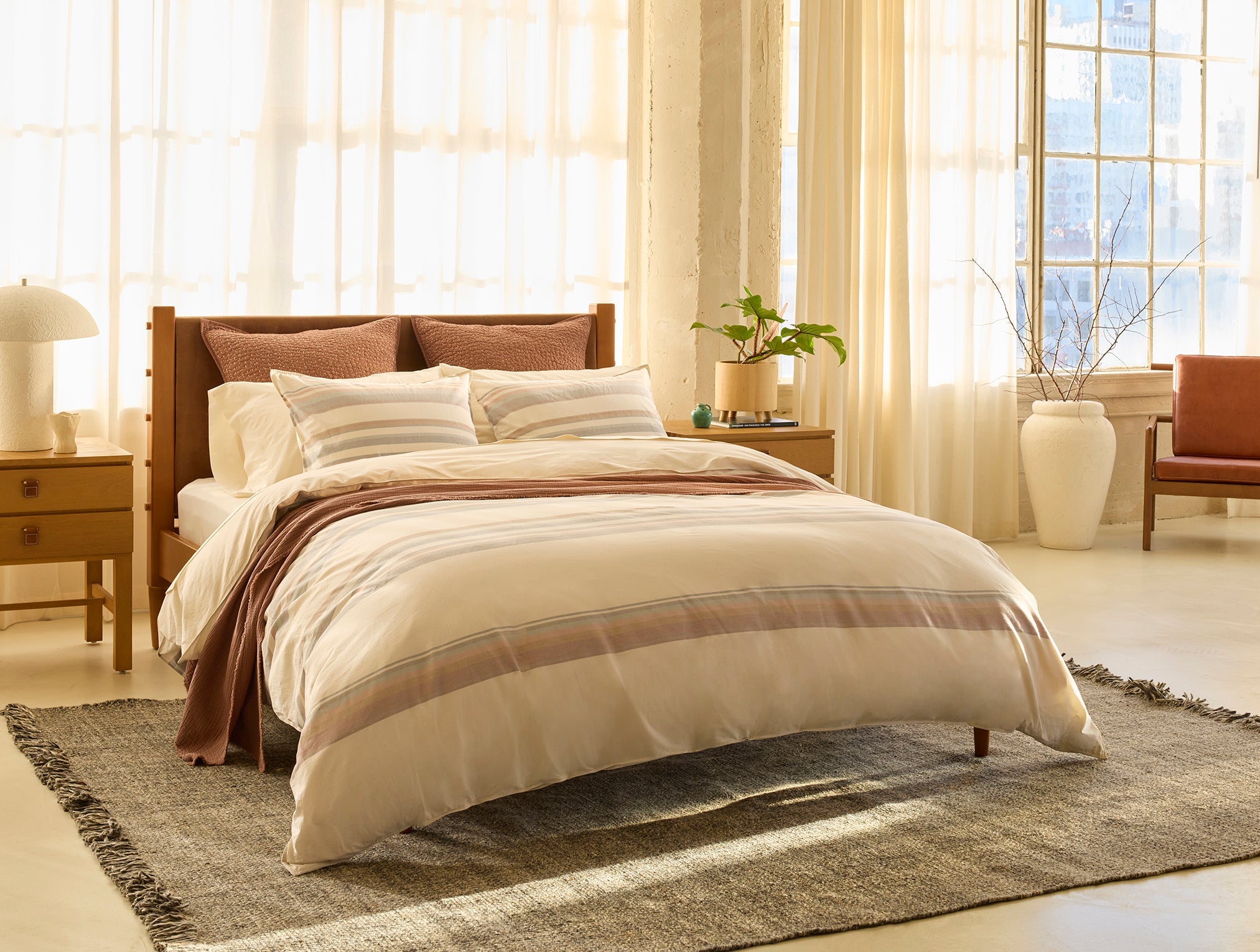 Coyuchi Crestridge Organic Duvet Cover - staged room with wood frame and side tables