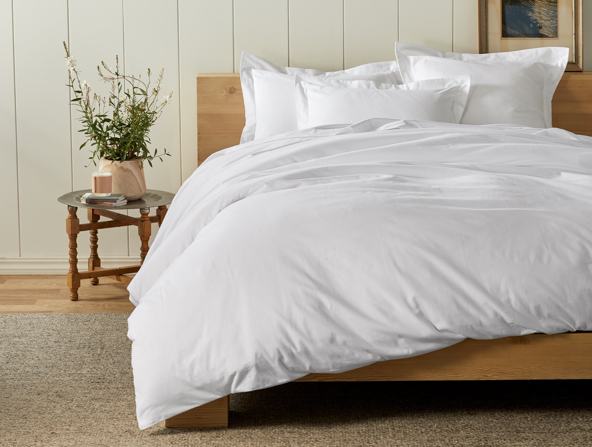 Coyuchi Organic Cloud Brushed Flannel Duvet Cover - staged bed plant on side table #colour_alpine white