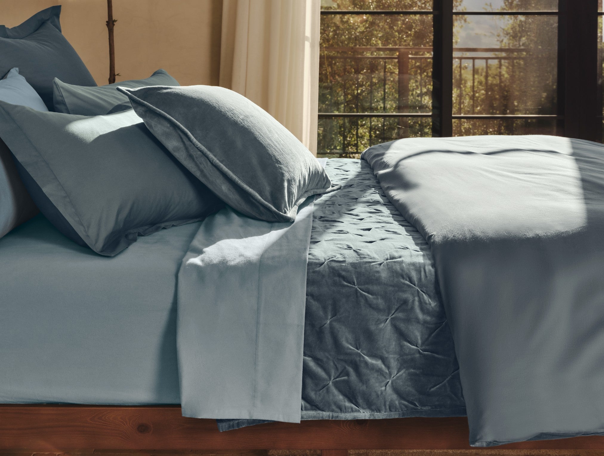 Coyuchi Organic Cloud Soft Sateen Duvet Cover - side profile staged bed #colour_gulf