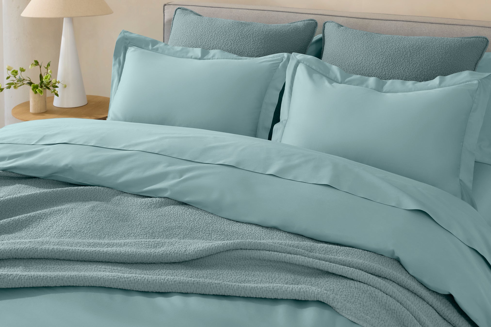 Coyuchi Organic Cloud Soft Sateen Duvet Cover - staged bed close up of pillows #colour_pacific blue