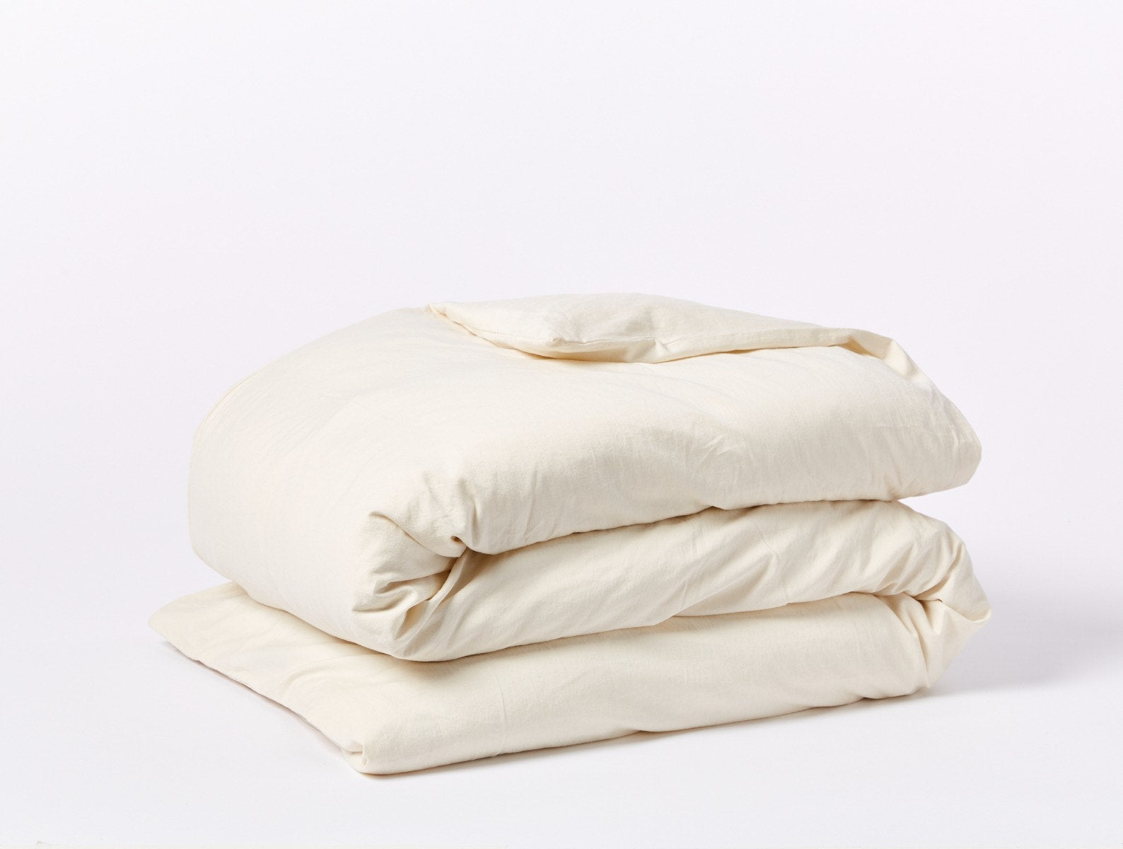 Coyuchi Organic Cloud Soft Sateen Duvet Cover - folded #colour_undyed