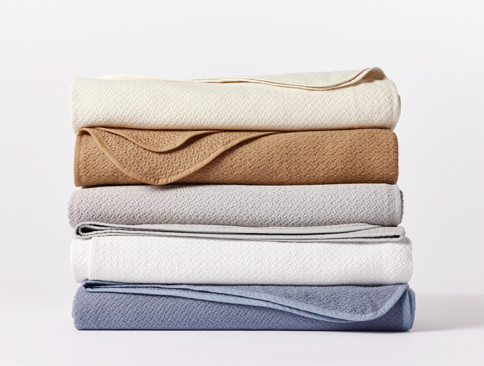 Coyuchi Organic Cotton Honeycomb Blanket - all colours stacked white background #colour_