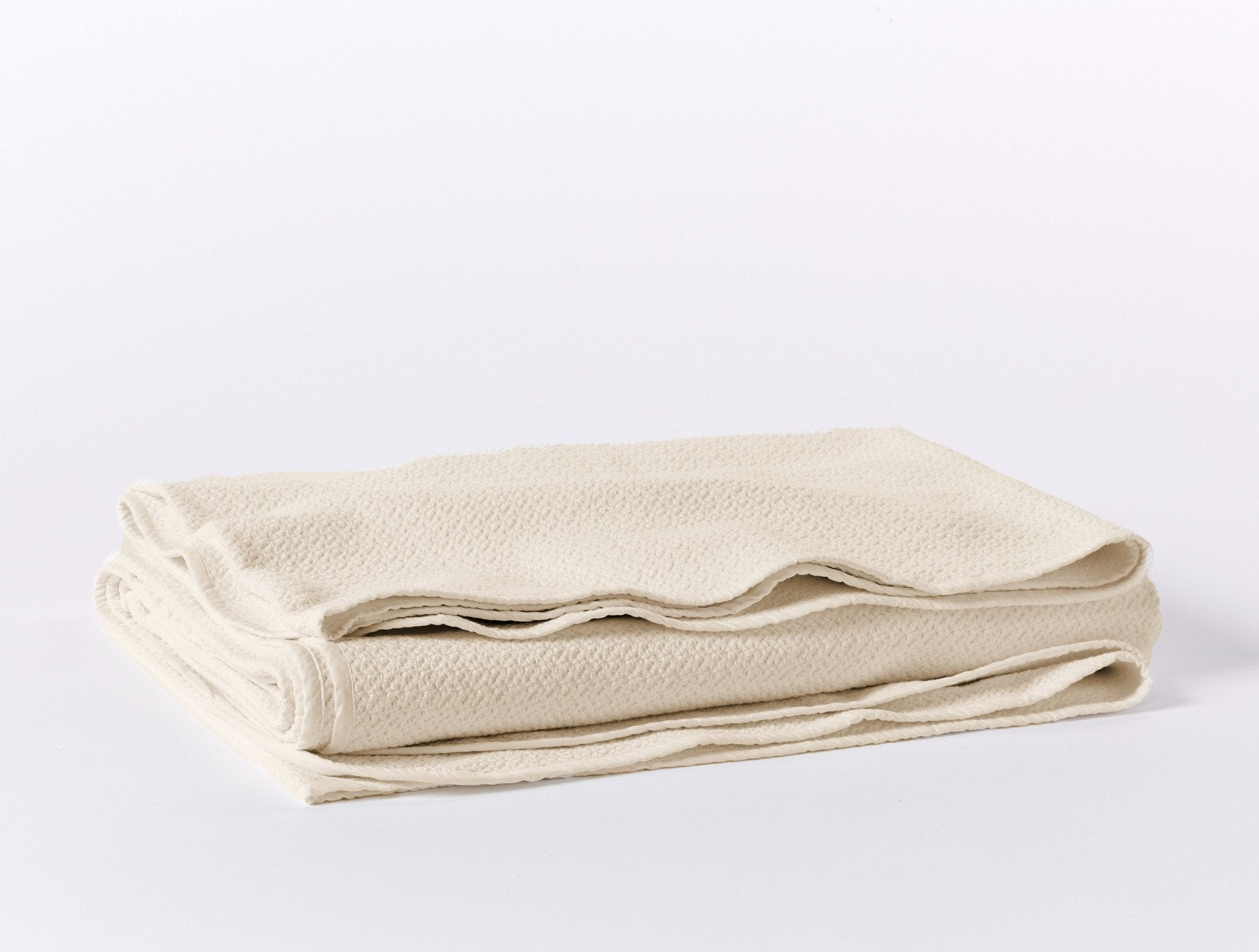 Coyuchi Organic Cotton Honeycomb Blanket - folded #colour_undyed