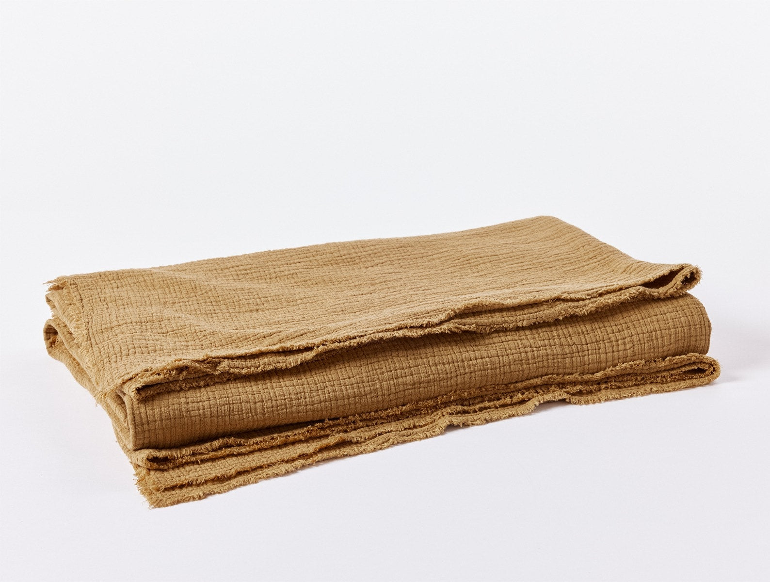 Coyuchi Organic Cotton Topanga Matelasse Blanket - folded #colour_hazel