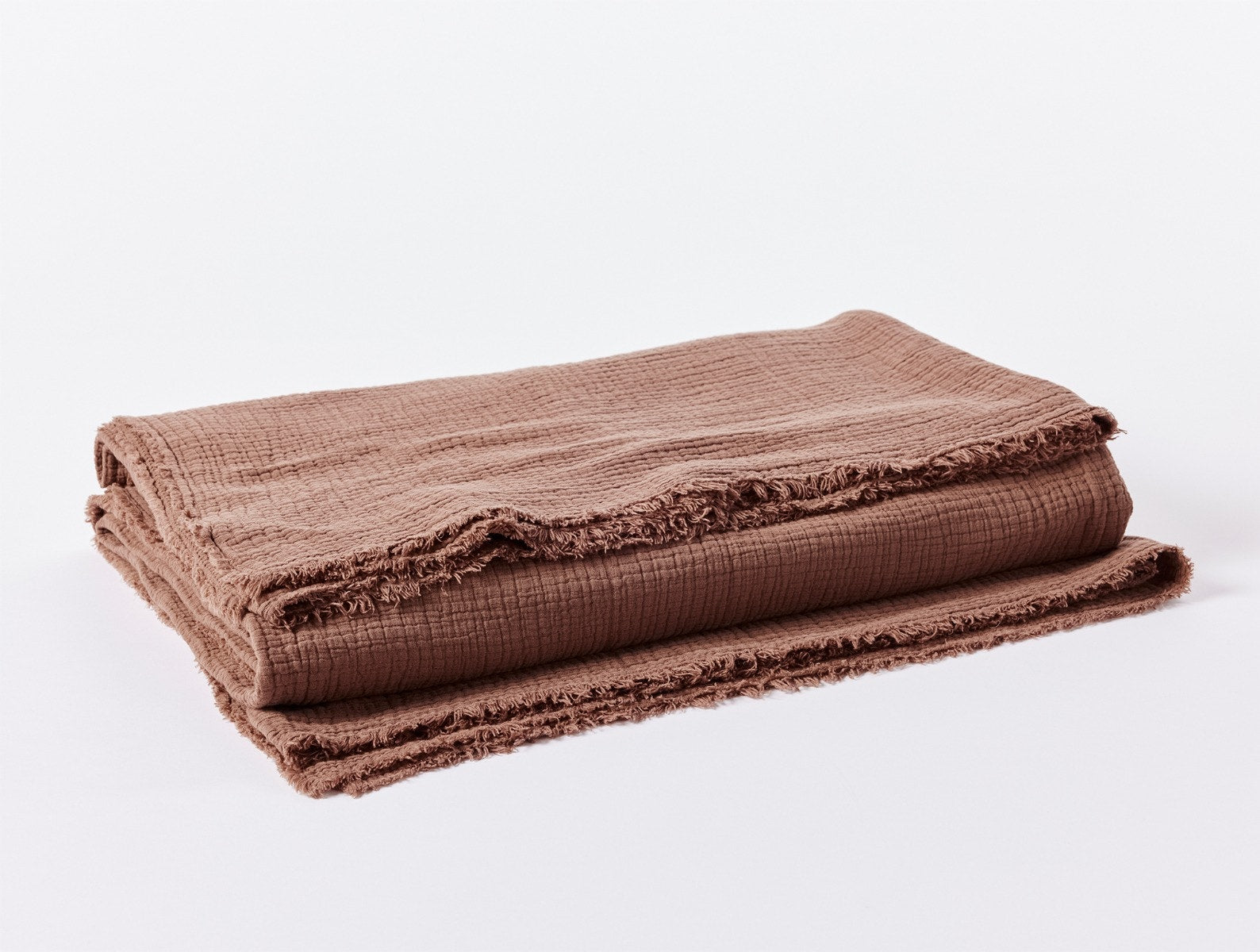 Coyuchi Organic Cotton Topanga Matelasse Blanket - folded #colour_redwood