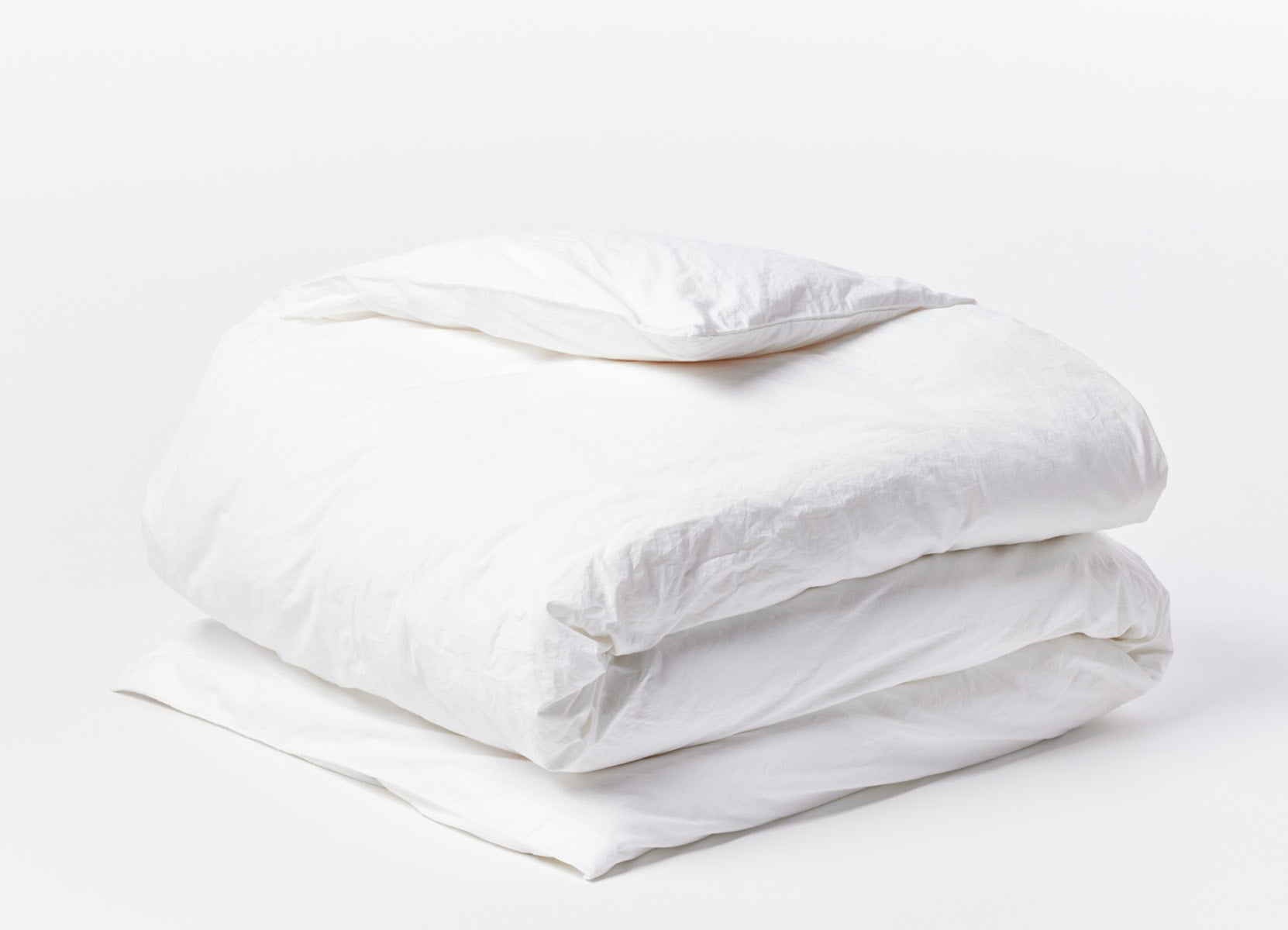 Coyuchi Organic Crinkled Percale Duvet Cover - folded #colour_Alpine White
