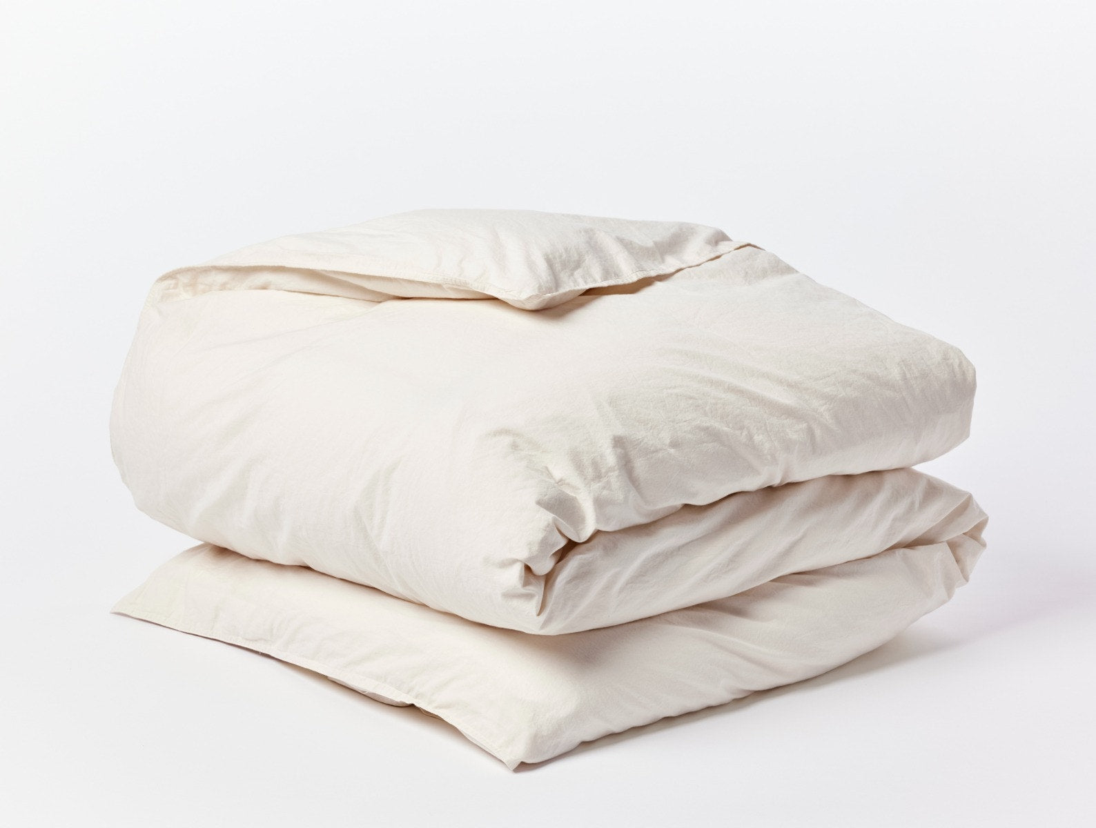 Coyuchi Organic Crinkled Percale Duvet Cover - folded #colour_undyed