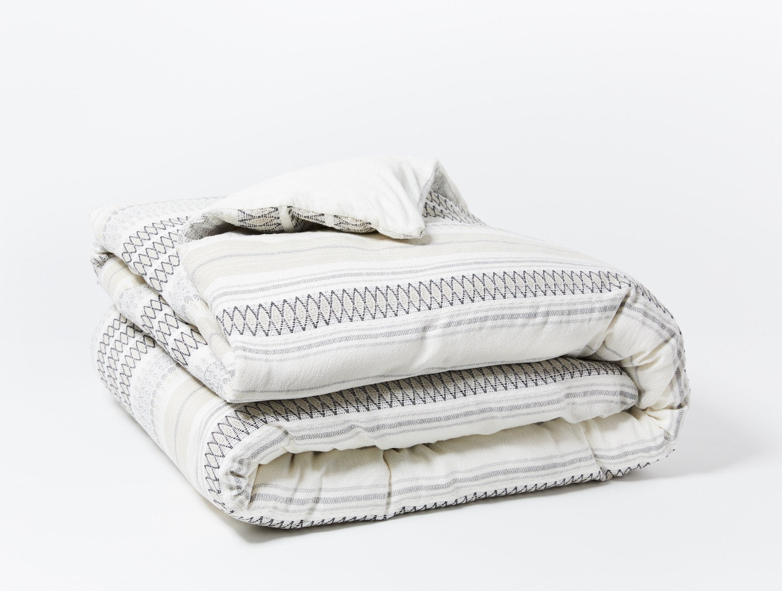Coyuchi Organic Lost Coast Duvet Cover - folded #colour_Soft White w/Deep Graphite