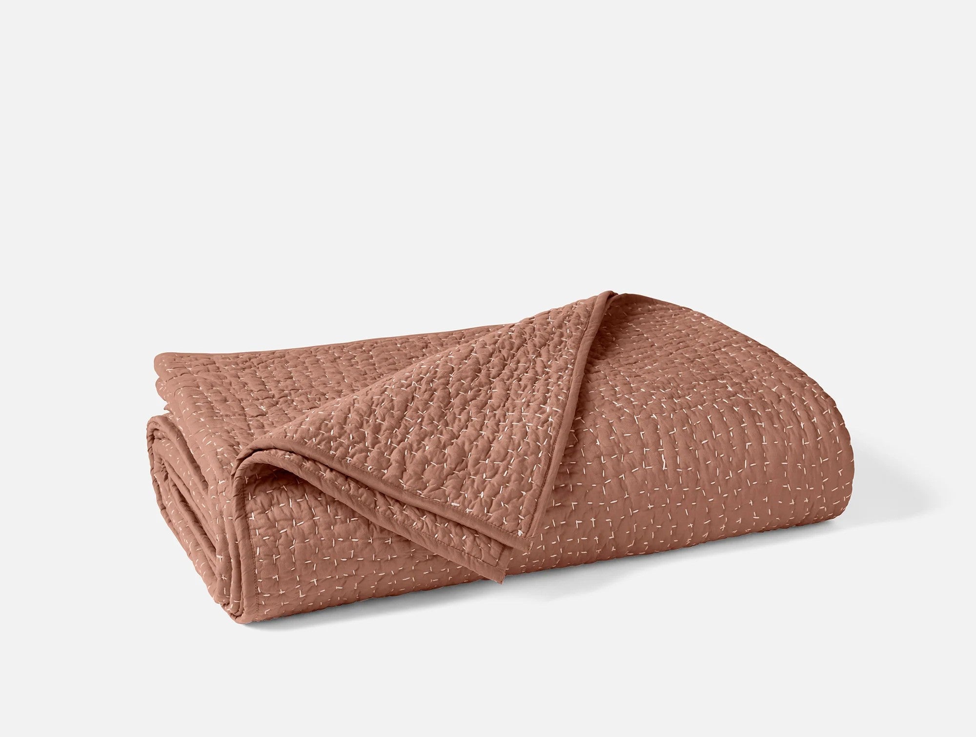 Coyuchi Organic Pebbled Hand Stitched Quilt - folded #colour_praline