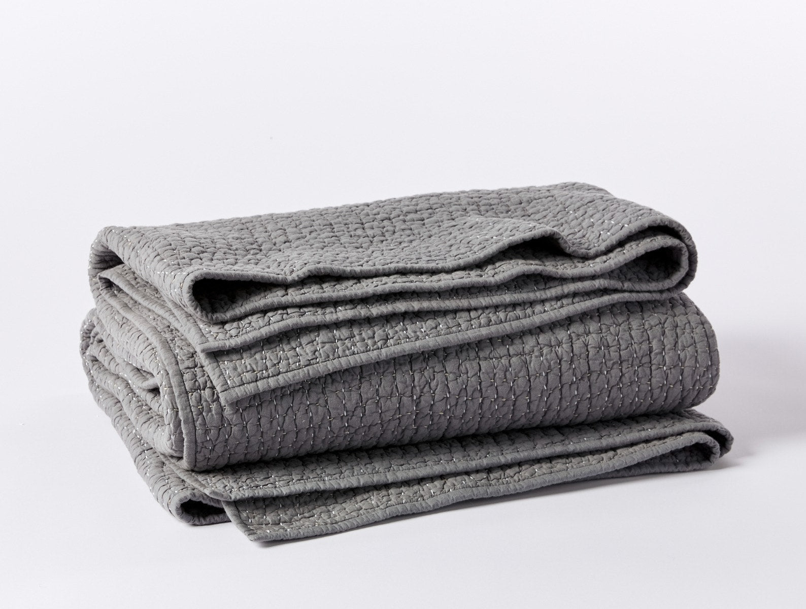 Coyuchi Organic Pebbled Hand Stitched Quilt - folded #colour_slate