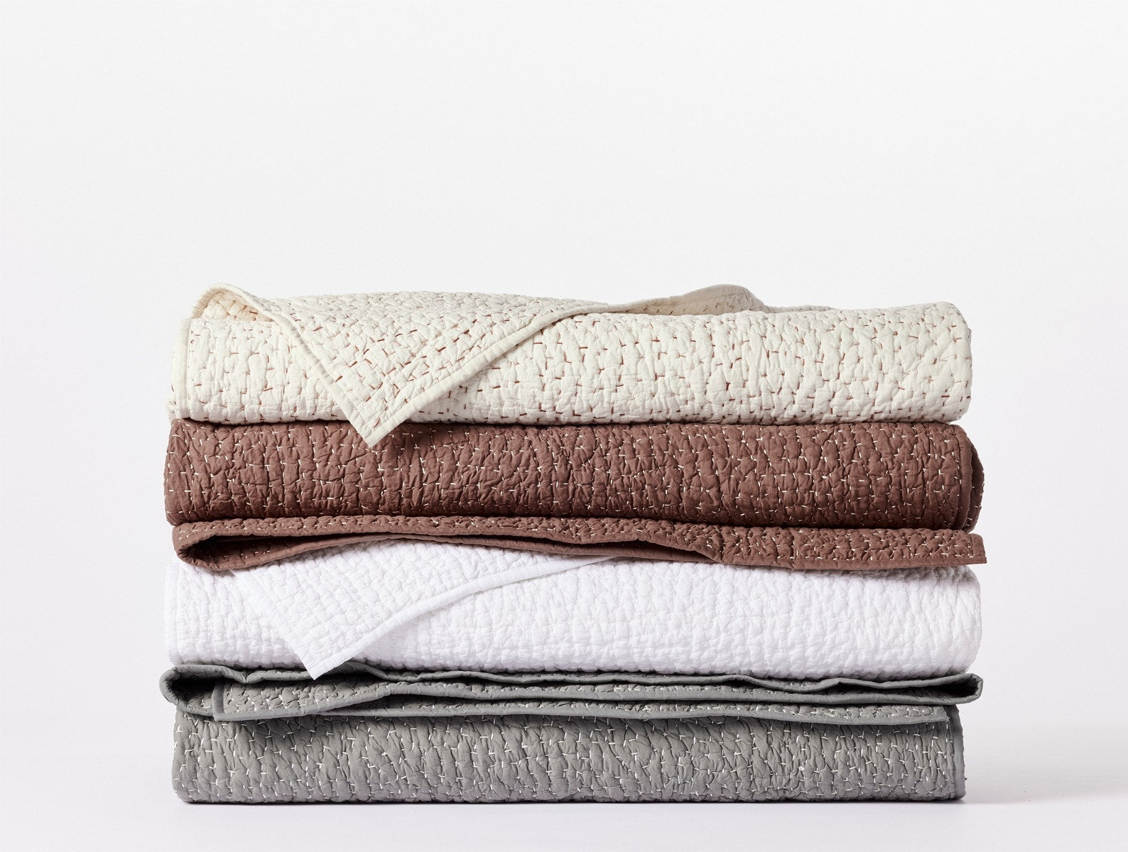 Coyuchi Organic Pebbled Hand Stitched Quilt - all colours stacked #colour_
