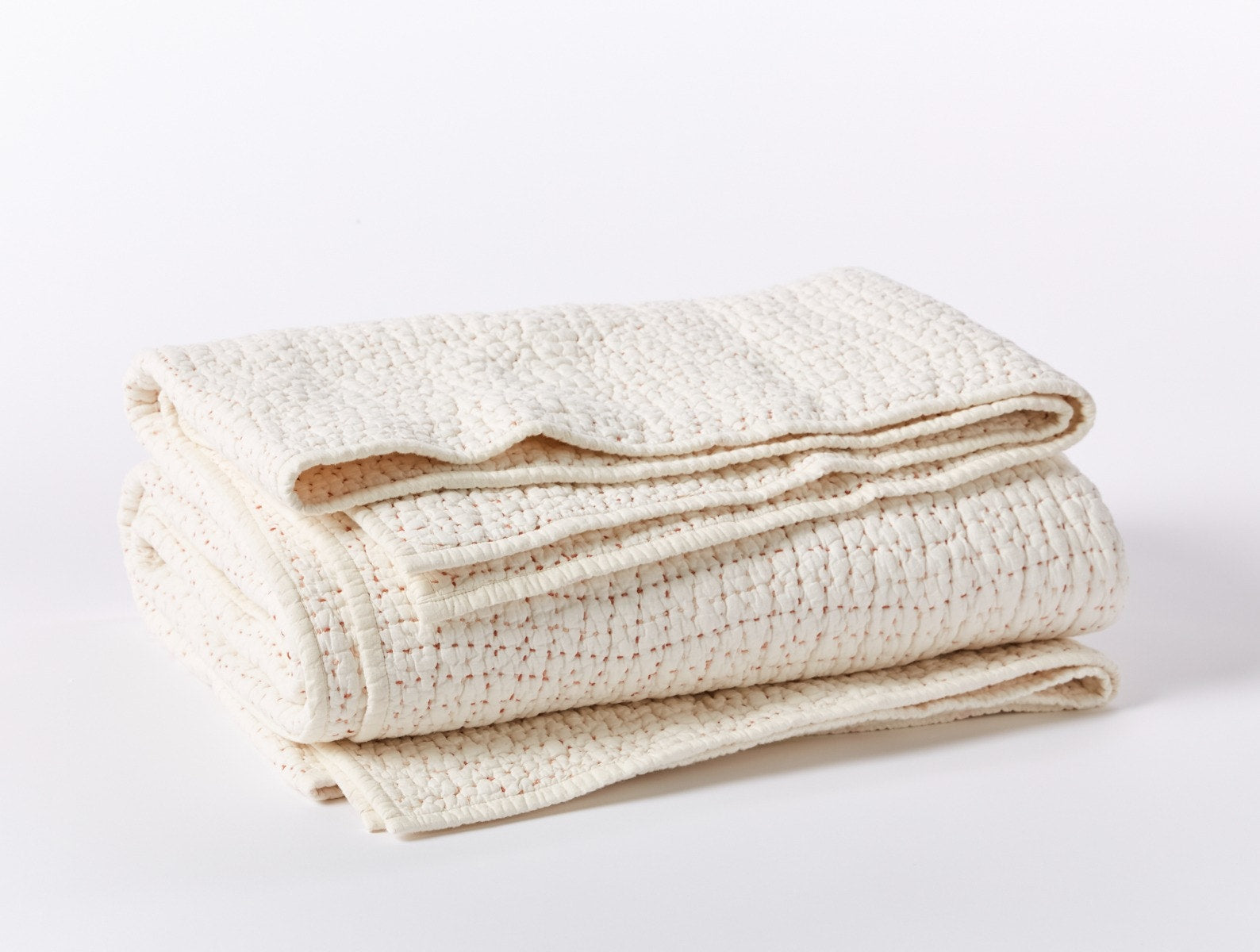 Coyuchi Organic Pebbled Hand Stitched Quilt - folded #colour_undyed