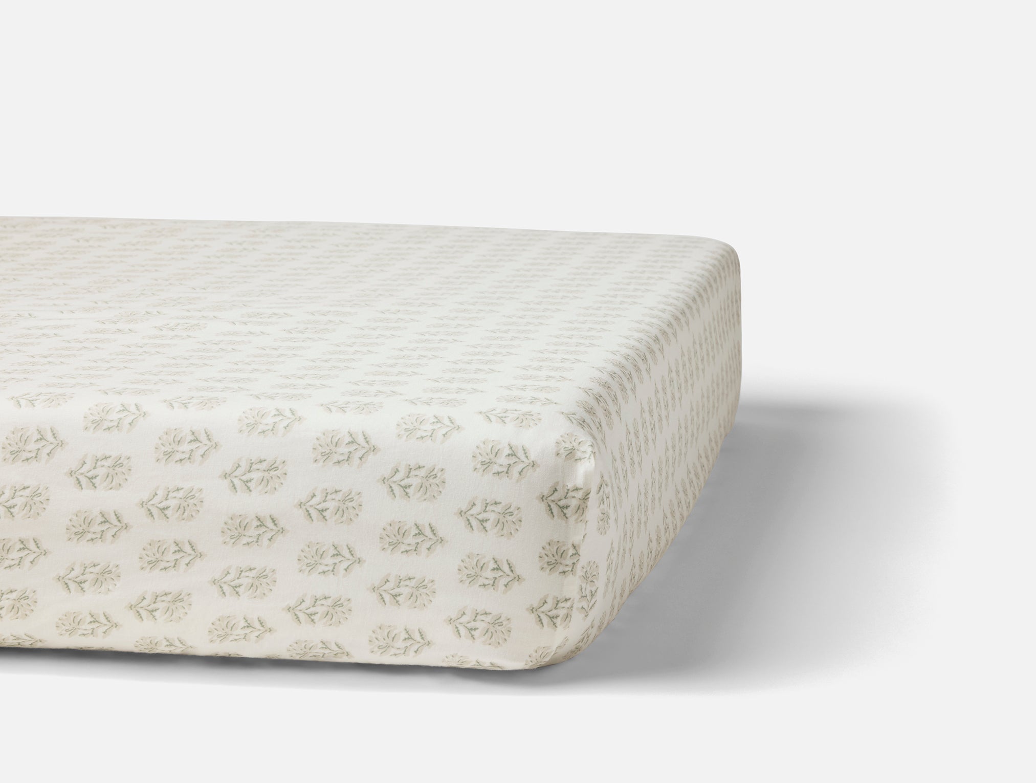 Coyuchi Organic Cotton percale Crib Sheet in Seafoam Chrysanthemum - on crib mattress #colour_seafoam chrysanthemum