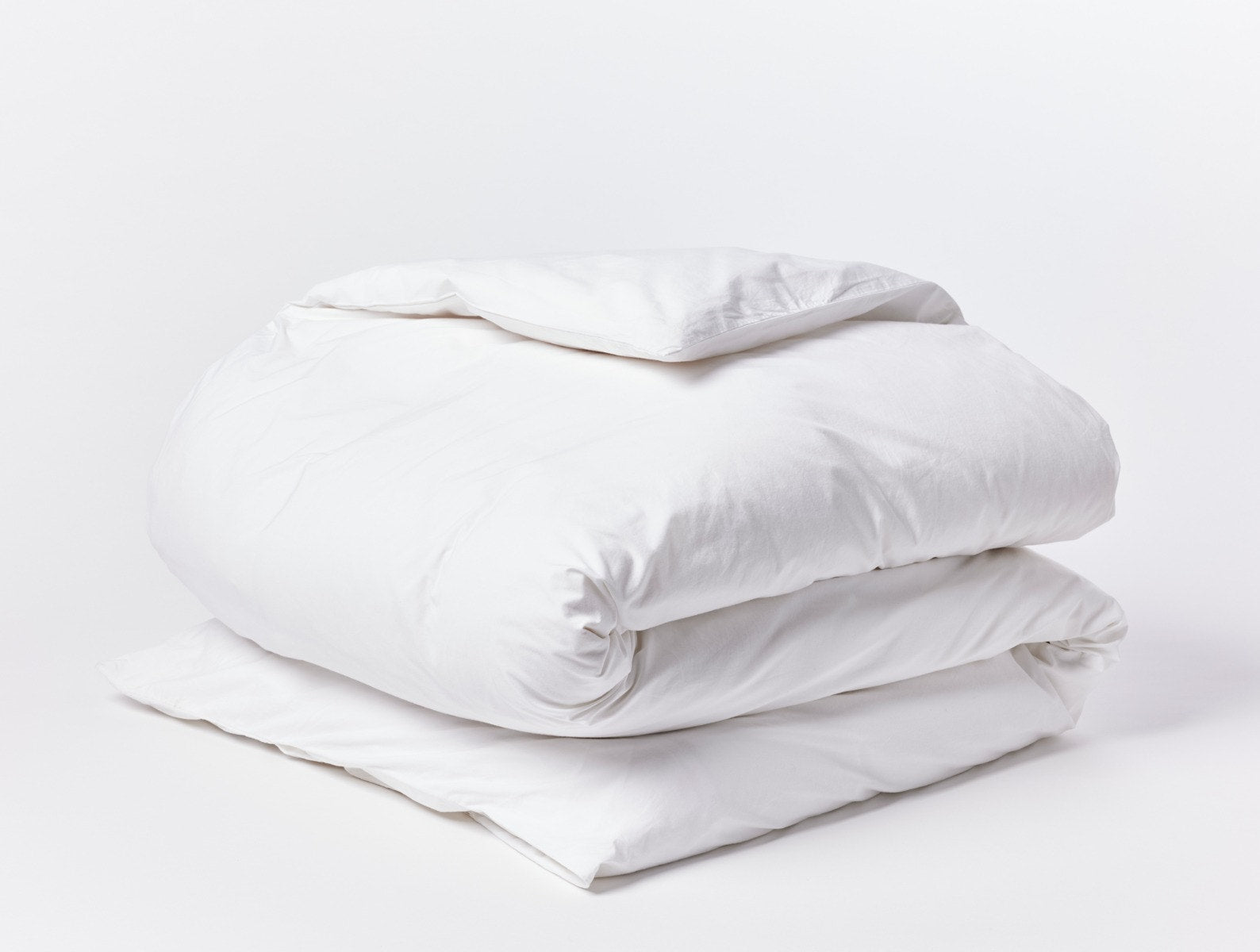 Coyuchi Organic Refined Percale Duvet Cover - folded #colour_alpine white