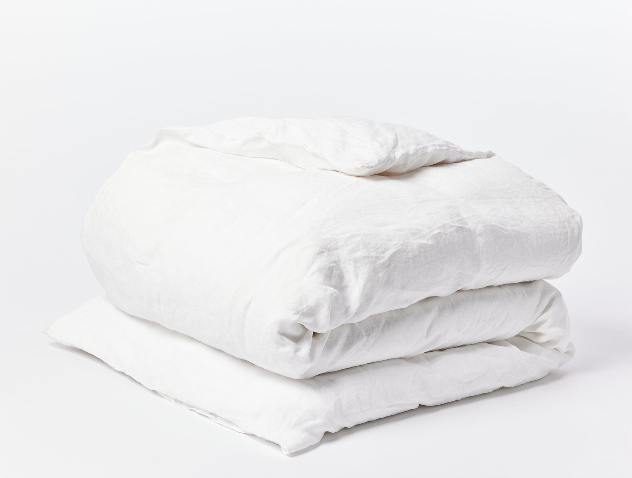Coyuchi Organic Relaxed Linen Duvet Cover - folded #colour_alpine white