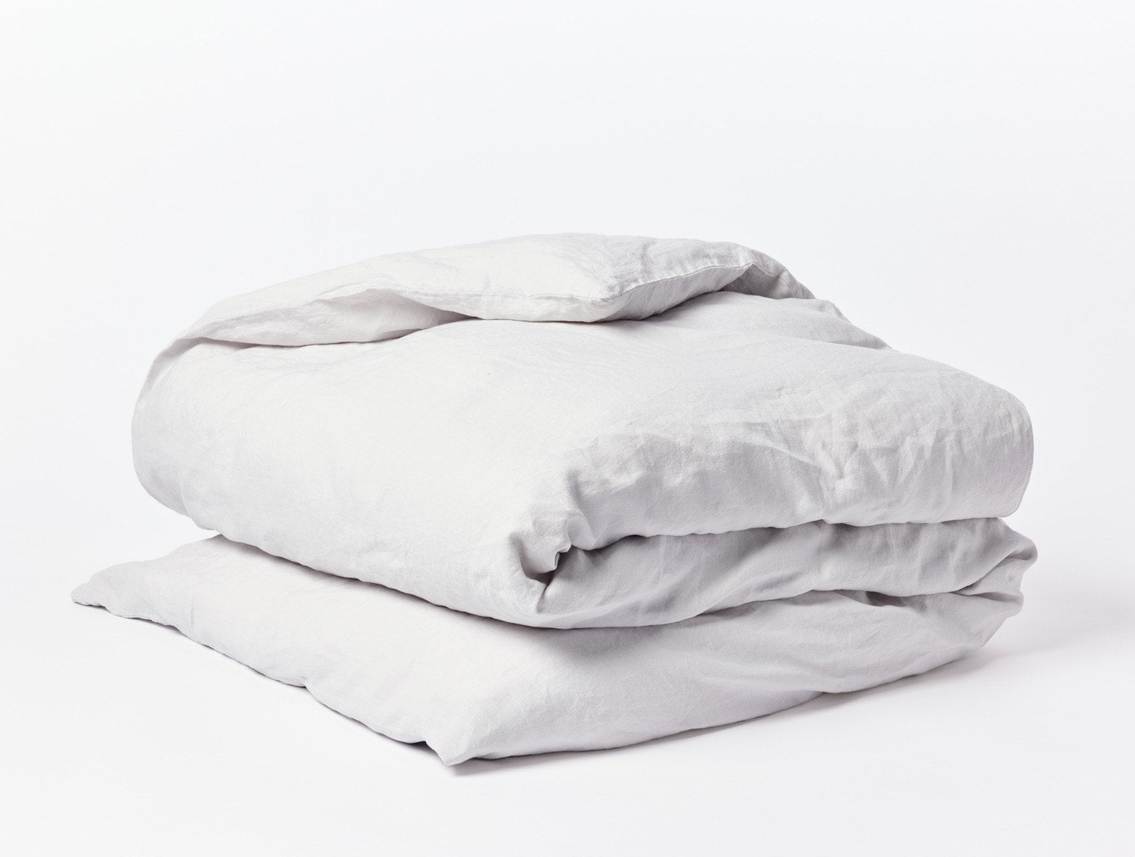 Coyuchi Organic Relaxed Linen Duvet Cover - folded #colour_fog