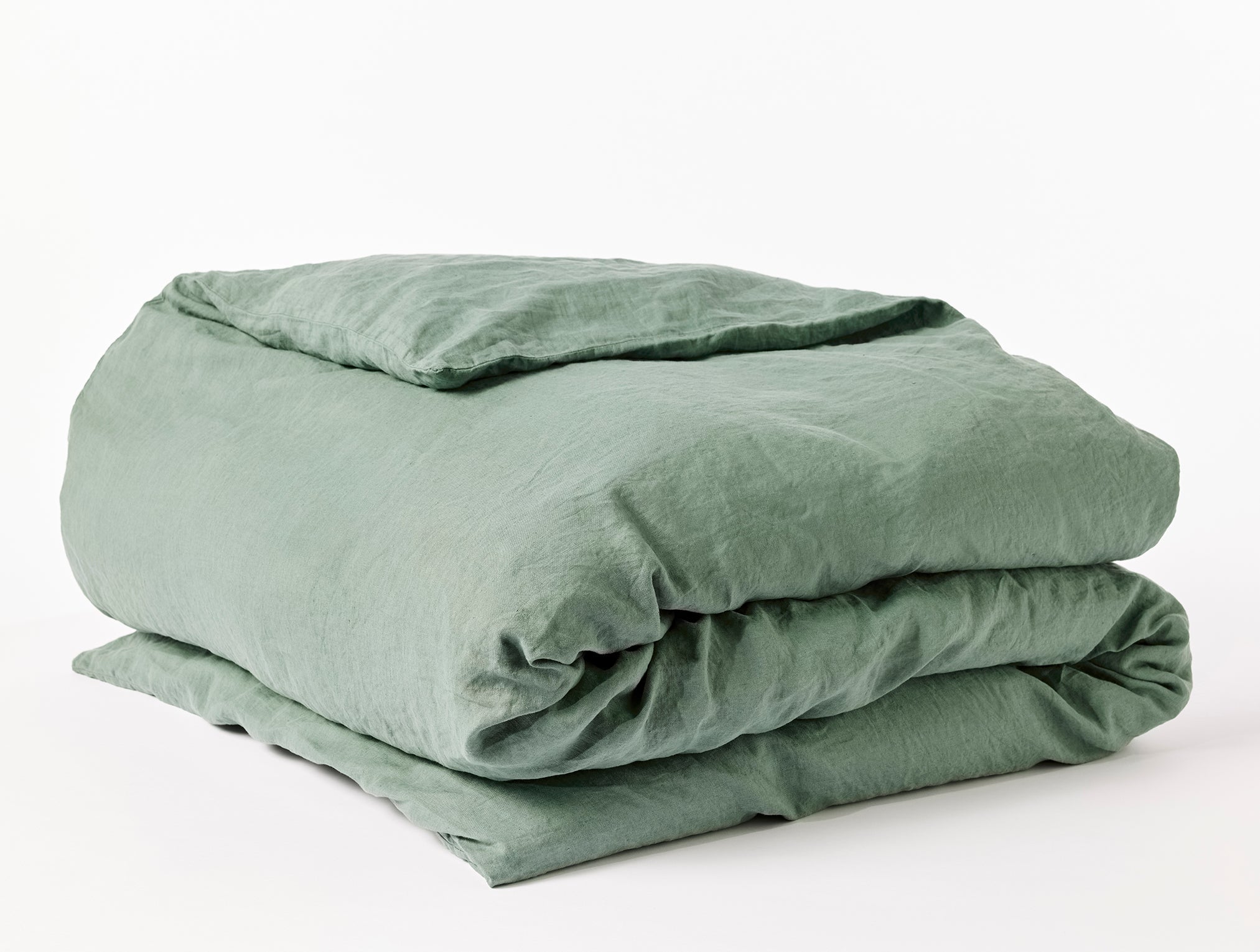 Coyuchi Organic Relaxed Linen Duvet Cover - folded #colour_juniper