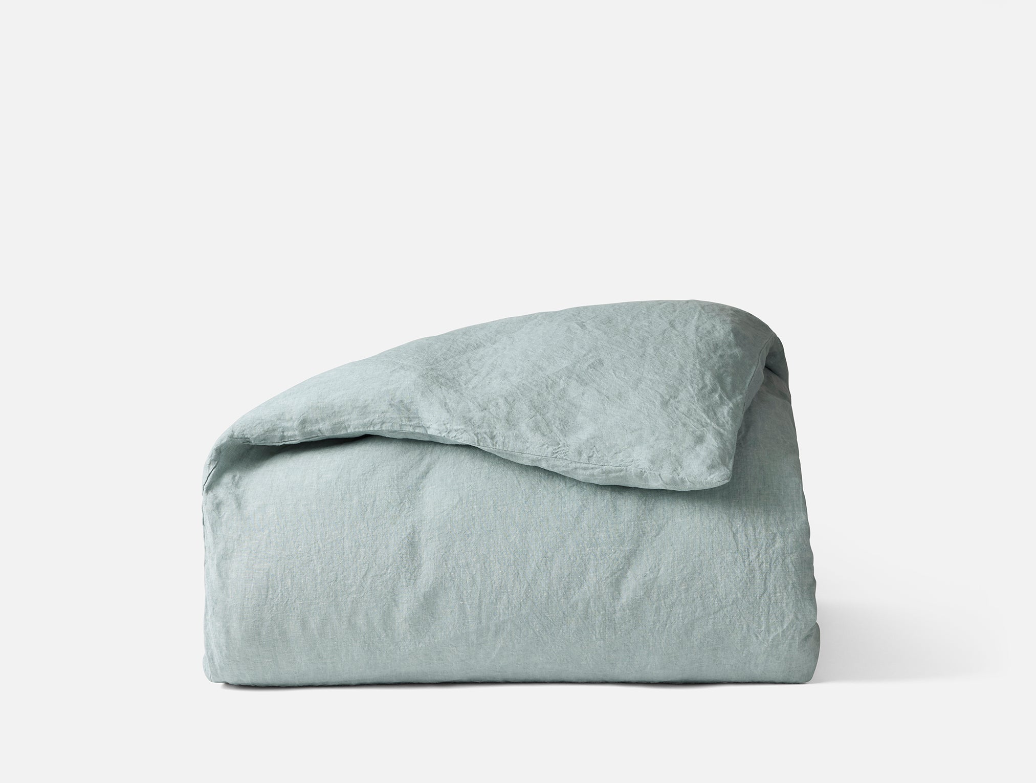 Coyuchi Organic Relaxed Linen Duvet Cover - folded #colour_pacific blue chambray