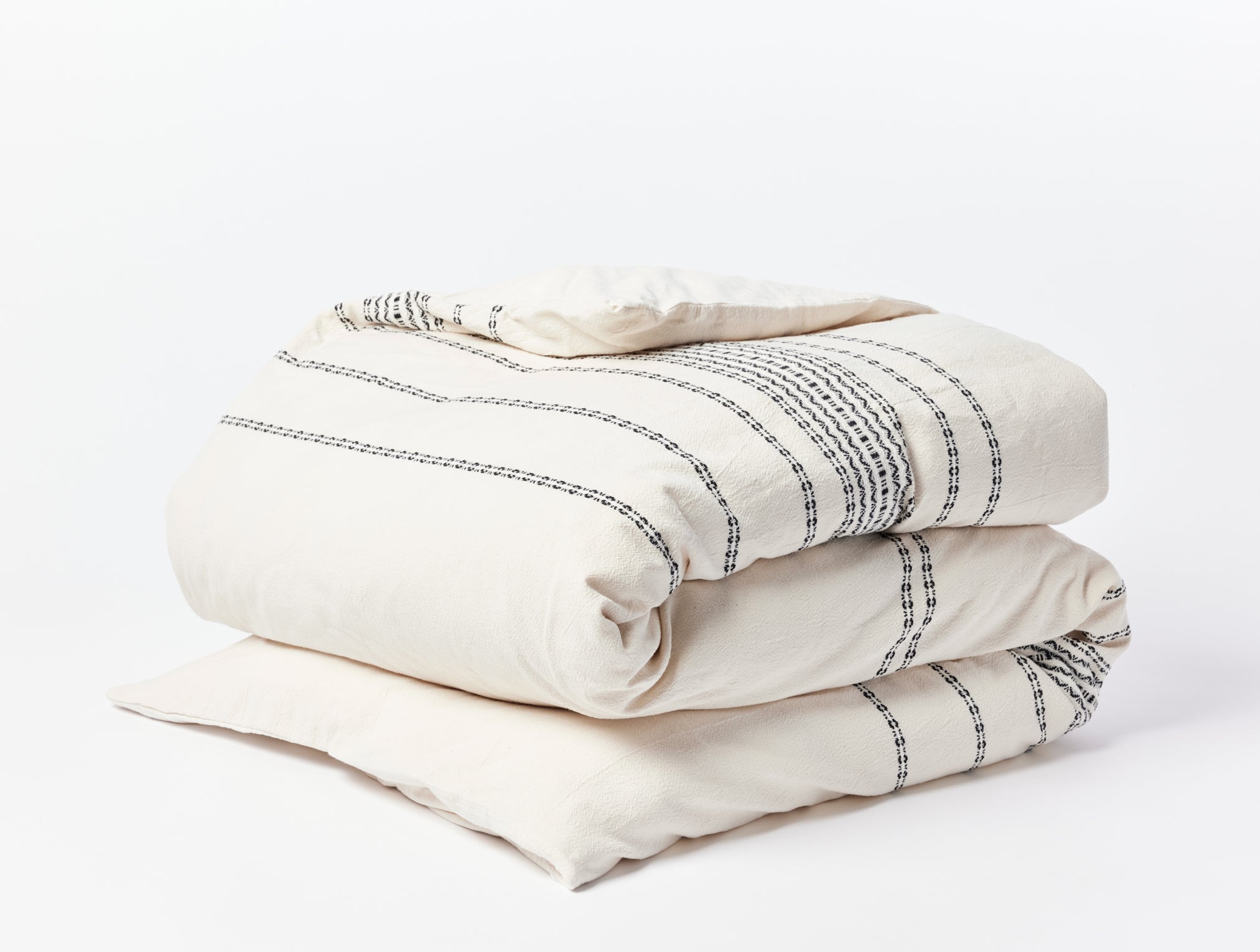 Coyuchi Organic Rippled Stripe Duvet Cover - folded #colour_ivory w/ black